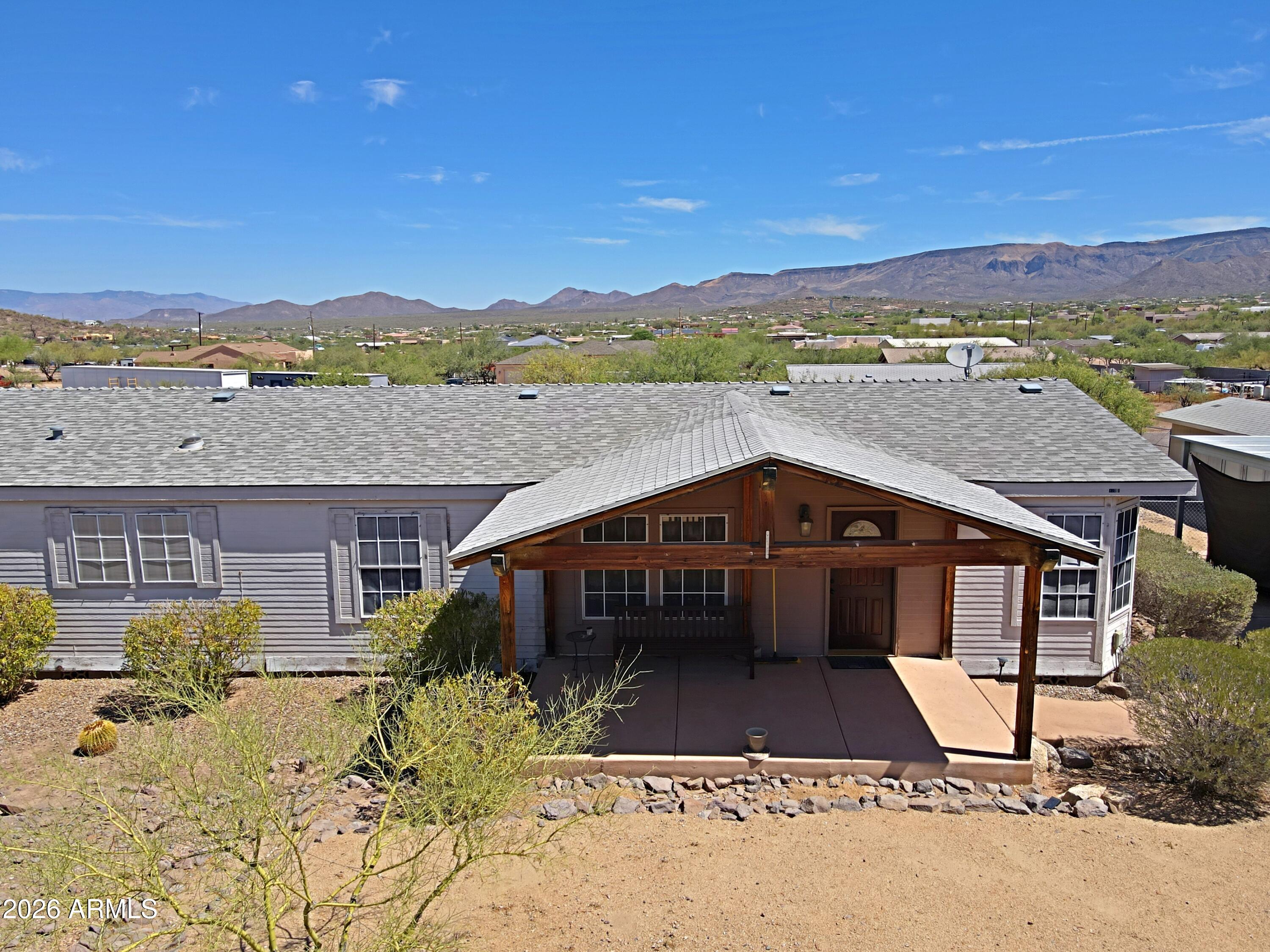 Looking for privacy and seclusion? Desirable New River, Circle Mountain, this multi generational home has a lot to offer: main house 2016 sf with 3 bedrooms, 2 baths, 2 car port, plus detached guest house 640 sf  with 1 bedrooms, 1 bath. Main house has large covered patio with south/north exposure.  Formal living room, dining room, spacious kitchen with kitchen island open to family room. Large 1.8 acre lot, level usable land, no flood zone, no hill side. Horse privileges. Privacy and  mountain views. New HVAC replaced in July 2026 Goettl.