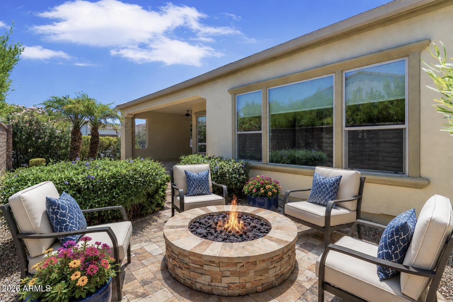Encanterra Country Club sets the stage for exceptional resort-style living in this beautifully maintained Genova floor plan, where thoughtful design and inviting outdoor spaces come together in one of the community's most sought-after locations. Situated on a premium corner homesite close to The Algarve pool & clubhouse. The spacious chef's kitchen features gas range, granite countertops, staggered cabinets, GE Profile appliances & large island that becomes the centerpiece for entertaining. The adjoining dining area & expansive great room overlook the backyard, creating a seamless connection between indoor & outdoor living. The primary suite features engineered wood flooring, dual vanities, framed mirrors, Roman tub, shower with floor-to-ceiling designer tile. bronze fixtures and a generous walk-in closet. The guest suite offers its own ensuite bath with a tiled tub surround, while the well-appointed powder room provides added convenience for family and guests.

Additional upgdrades include an Open Den/Office, Smart Space laundry room with workstation, courtyard pavers, two-tone paint, water softener, RO system, and an extensive collection of thoughtful upgrades that reflect the exceptional pride of this original owner. 
Step outside to your private backyard retreat, where extended travertine hardscaping surrounds a built-in gas fire pit. The premium corner homesite enhances both privacy and curb appeal, offering a peaceful outdoor sanctuary just moments from Encanterra's world-class amenities

The community is well-known for the award-winning, private Tom Lehman designed Golf Course. It has every amenity imaginable: pickleball, tennis, bocce, state of the art health & fitness center, Alvea Spa, just to name a few. The list of community activities is never-ending: concerts, classes, social clubs, car shows, events and much more. Eateries include: La Palma (the signature restaurant, in a beautiful atmosphere with panoramic views), Bodega Wine and Café (for small plates and wine tasting), and the Solaz and Algarve pool Grills. There are four pools to enjoy. The Solaz pool sits adjacent to the golf course with stunning views. The Algarve, the adult-only pool, is perfect for a little added relaxation. Join the Fun and the Good Life at Encanterra!