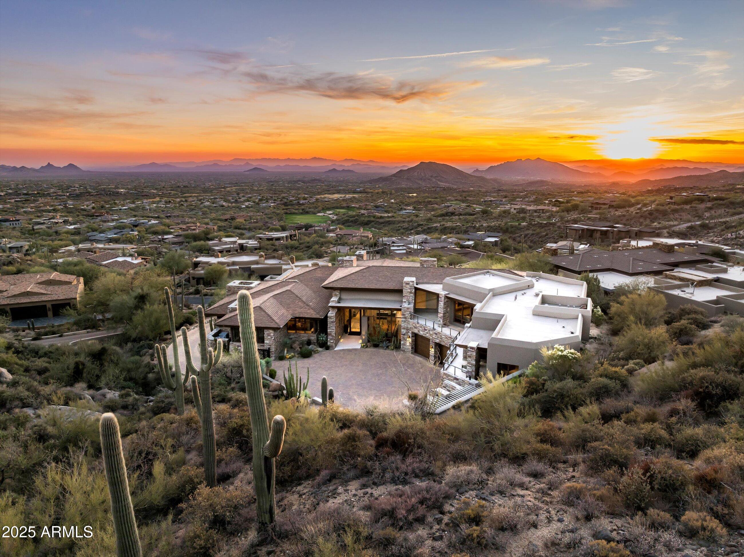 Magnificent Desert Mountain gated hilltop estate with  GOLF MEMBERSHIP available from  Seller. This Lost Star custom home's first ever offering! Soft contemporary smart home boasts open plan,  appointed with today's exquisite finishes and lighting by award winning Lee Hutchison/Manship Builders team. Commanding Valley views offer year-round sunsets & city lights.   Amazingly appointed chef's kitchen. Wow home theater! Primary wing with separate his/her bath amenities and double offices. Upper 4 BR guest wing features elevator, family room. kitchen bar. laundry and separate entrance. 4-car climate-controlled garage with auto court and dream storage. All in renowned Desert Mountain community with 7 golf courses, tennis, pickleball, croquet and a myriad of year-round activities.