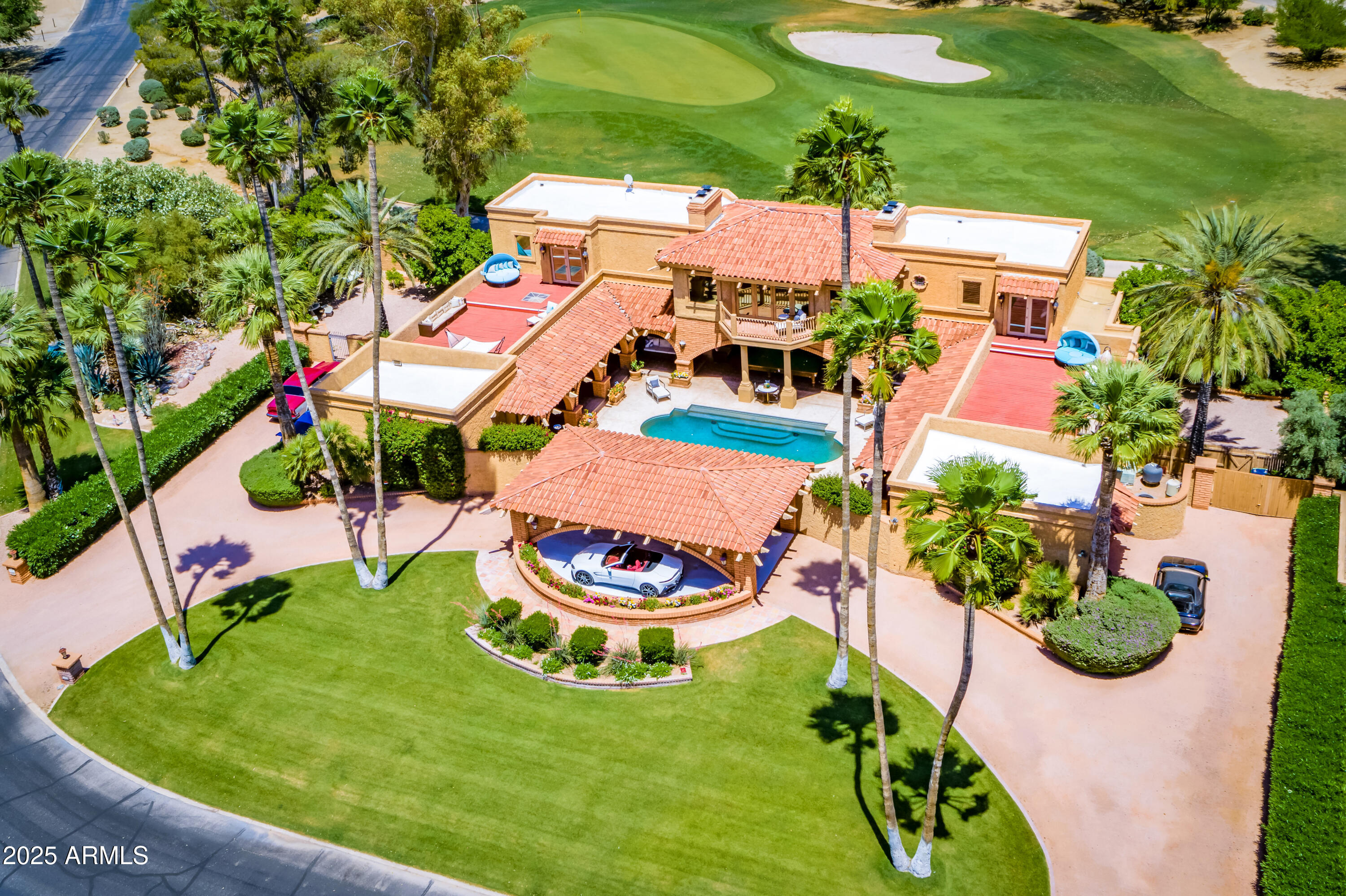 There is ultra-luxury, and then there is this true Unicorn, Statement Property, and Trophy Estate. This award-winning, completely rebuilt, corner golf green home is located in the most expensive neighborhood in the Southwest United States. In addition to the five centerpiece Unicorn features described below, this Legacy home's Unicorn status is underscored by its designation as the #1 Single-Family Home rental in Arizona with $51K in monthly rental revenue. This turnkey home's distinguished prior mid-term (multi-month) vacation rental tenants include A-list celebrities, superstars, and even billionaire tenants arriving in personal helicopters while renting this home. This Santa Barbara estate occupies the best lot in the heart of a storied Paradise Valley neighborhood, where homes that have sold for $15M+ would rent (even on their best day) for less than half this home's rental revenue of approximately $51K per month. Therefore, this Unicorn home is a monetized hard asset. The difference in the valuation of a monetized hard asset (for example, Facebook with advertising revenue) and an unmonetized hard asset (for example, Facebook without advertising revenue) is night and day.

The standard ultra-luxury market's Cap Rate of 2% and Operating Income (NOI) of $400K yield a home valuation of $400K/0.02=$20M. This $20M is a conservative estimate because it does not take into account the huge premium for the following five Unicorn centerpiece features that no other home in the world has:
(1) Floodlit Championship Golf Green for Night Golf: This is the only home with the ability to play night golf and evening golf on a floodlit championship golf green with direct frontage on a championship golf green, instead of an artificial putting green in an ordinary backyard. 
(2) Prime Corner Location: Within a corner lighted championship golf green (a green ocean) location, at the nexus of four different holes (Holes 3, 4, 15 and 16), this perched promontory home and corner golf green lot are elevated in height with only one adjacent neighbor and private security patrol in the heart of Paradise Valley's acclaimed subdivision in this Audubon Bird Sanctuary designated area. This home towers over all other homes in the neighborhood with expansive 360-degree golf green, golf course, and mountain views from the home's 32 massive UV-protected double-paned picture windows, 20 glass French doors, and 3 colossal balconies and view decks.
(3) Direct frontage on a Championship Golf Green with dynamic views of birds and birdies. Less than 1% of Golf Course homes are Corner Golf Green homes. 
(4) Mountain views of both Mummy Mountain and McDowell Mountains. This home has beautifully landscaped, peaceful grounds with 27 palm, citrus, and eucalyptus trees. 
(5) Extreme privacy with true indoor-outdoor resort-style living because of the interior, palatial courtyard (enclosed on all four sides) with a Roman skinny-dipping pool, Grecian columns, Finnish Sauna, and a Tournament-sized 12-foot snooker table imported from a castle in England, located in an Arizona Room with motorized shades.

Instead of buying inferior, boxy, retail-store-look-alike new construction homes, discerning and smart buyers look for Unicorns that are a great store of value when it comes to their real estate, stock, and art purchases. Unlike other homes in the neighborhood that do not have direct access to the golf course (without having to walk through the town's roads) in this Zen Retreat home you can take early morning, evening and night golf course walks straight from the master bedroom wing's sideyard door as if the golf course in the most expensive zip code was your own backyard of 10 acres, and your dogs will never ever have to see a leash again in your own personal golf course private park that also happens to be very near the new Ritz Carlton resort with America's longest swimming pool. 

Turnkey home has upgraded mobile app home automation systems (for security, HVAC, pool, landscaping), timeless finishes and cutting-edge features including Wolf & Thermador appliances, custom cedar, mahogany & aged cherry cabinetry, tumbled marble backsplashes, new PebbleTec pool with spa & outdoor shower, Marge Carson & Ralph Lauren furnishings, Master bedroom wing with true Finnish sauna room & skylight jacuzzi, temperature controlled surround showers, Travertine & Terracotta floors, textured Venetian stucco with chip-resistant bullnose wall corners, gourmet kitchen with warming drawers & large picture windows overlooking a championship golf green, remote-controlled Levolor shades in all 20 French glass doors & 32 picture windows, plantation shutters, enormous side yards and front yard with circular driveway with tallest palm trees in Paradise Valley, carport & outdoor surround sound, water features and four wood-burning brick fireplaces.

Lord Byron wrote: "There is pleasure in the pathless woods, there is rapture in the lonely forest, there is society where none intrudes, and music in its roar. I love not Man the less, but Nature more." These words best capture the timeless spirit and class of this beautiful Unicorn home that has won several prestigious international awards, including the coveted 300 point-validation Airbnb Luxe status award, the highest possible Top 1% award, the Guest Favorite award, and the Gold Badge award. Location and cashflow are everything in real estate, and this home has both - the best location (with a distinctive regal Unicorn home on the best lot) and the resulting best cashflow as evident by the fact that it is the #1 rental.