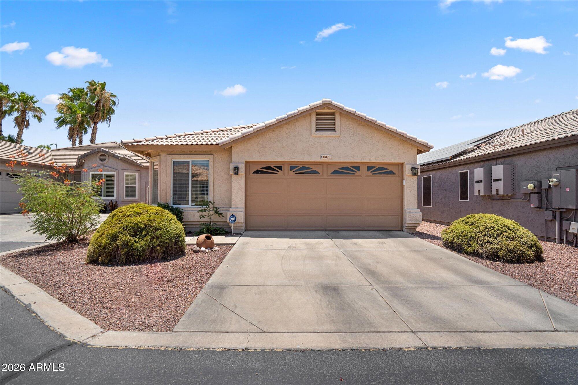 This is a very special opportunity! This home is filled with charm and is in impeccable condition. Two bedroom and two baths with a great room that is open to the kitchen. Covered patio leading out to a wonderful turf grass yard and extended paver patio space. Full two car garage. Water heater new in 2023,
