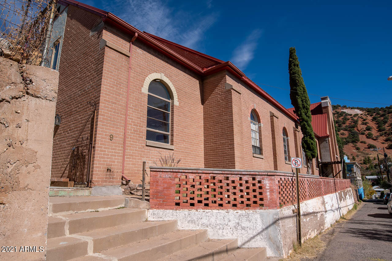 UNIQUE is an understatement for this amazing Bisbee residence. This structure was originally built in 1909 as a Church. The recent owner had converted the front portion of the structure into a 2 story home with most of the rooms completed. Fully equipped kitchen and bathroom, large dining area with beautiful wood ceilings. Custom doors, trim and wood flooring throughout the 2nd level. Original tile on main level along with an abundance of extra space and character to make this property your own! Don't miss the opportunity to own a little bit of Bisbee history and make it your own!