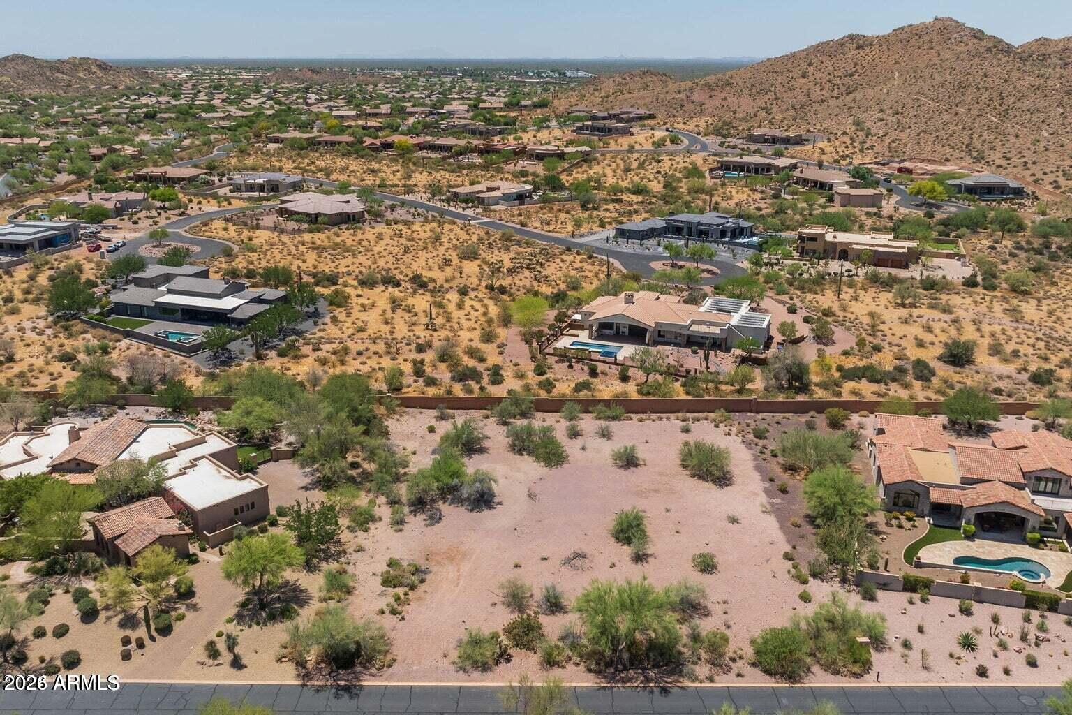 North/South facing premium custom homesite with fabulous views of the Superstitions! Located in Ponderosa Village of Superstition Mountain Golf Club which has two 18 hole phenomenal courses designed by Jack Nicklaus. Other activities include hiking, biking, tennis, pickleball & swimming. In addition, there is also a fitness and wellness center to grab a work out. 24 hour guard gated entry to ensure privacy. Lot is flat and ready to build your dream home. Minimum 2500 sqft required.