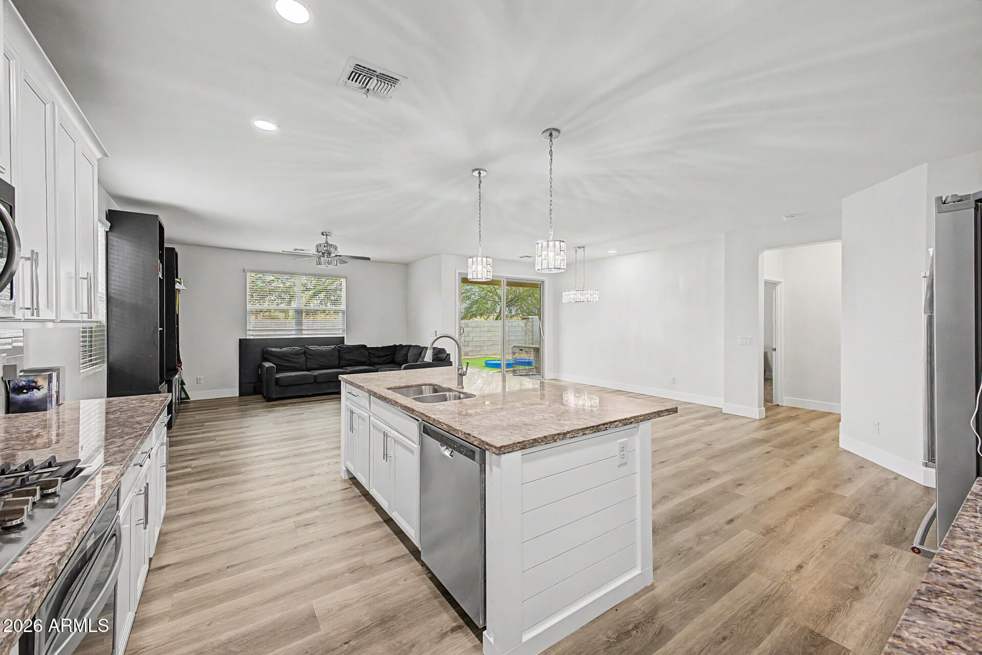 Welcome to this charming single-level home in Marbella Ranch! Providing 4 beds, 3 baths, 2-car garage, and a low-care landscape. The inviting interior features tons of natural light, a neutral palette, wood-look flooring in common areas, and plush carpet in bedrooms. Designed for everyday living & entertaining, the seamlessly flowing open layout is sure to impress! The impeccable kitchen boasts granite counters, subway tile backsplash, a walk-in pantry, recessed & pendant lighting, white cabinetry w/crown molding, SS appliances w/cooktop gas, and an island w/breakfast bar. The large main bedroom has an ensuite with dual sinks, separate tub/shower, & a walk-in closet. Discover the backyard with a covered patio & artificial turf, where you can relax or enjoy BBQ! Don't miss this opportunity!