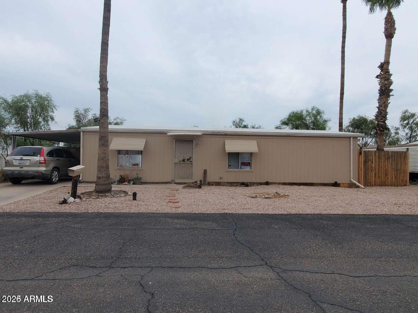 GROUND SET***3 BEDROOM 2 BATHROOM 1983 FLAMINGO 24X48 DOUBLEWIDE,UPDATED IN 2021 WITH NEW FLOORING,PAINT INSIDE/OUTSIDE,NEWER WASHER/DRYER INSIDE,MASTER BATHROOM,2ND BATHROOM READY FOR YOU TO CUSTOMIZE,MINI SPLIT HEATING/COOLING,1 WINDOW AC UNIT,FENCED YARD/PET FRIENDLY, Can be used as a year-round primary residence or a seasonal ''snowbird'' home, or an investment property to rent.2 CAR COVERED CARPORT 2 SHEDS. Welcome to Chandler Estates, a quaint ''55 or Better'' community that boasts year-round sunshine, just minutes from downtown Chandler, Arizona. Although surrounded by the hustle and bustle of the city, our community offers the seclusion and quiet of a desert resort, while maintaining proximity to shopping, fine dining, beautiful parks, trails, and golf courses*LOT RENT $1,200.00*