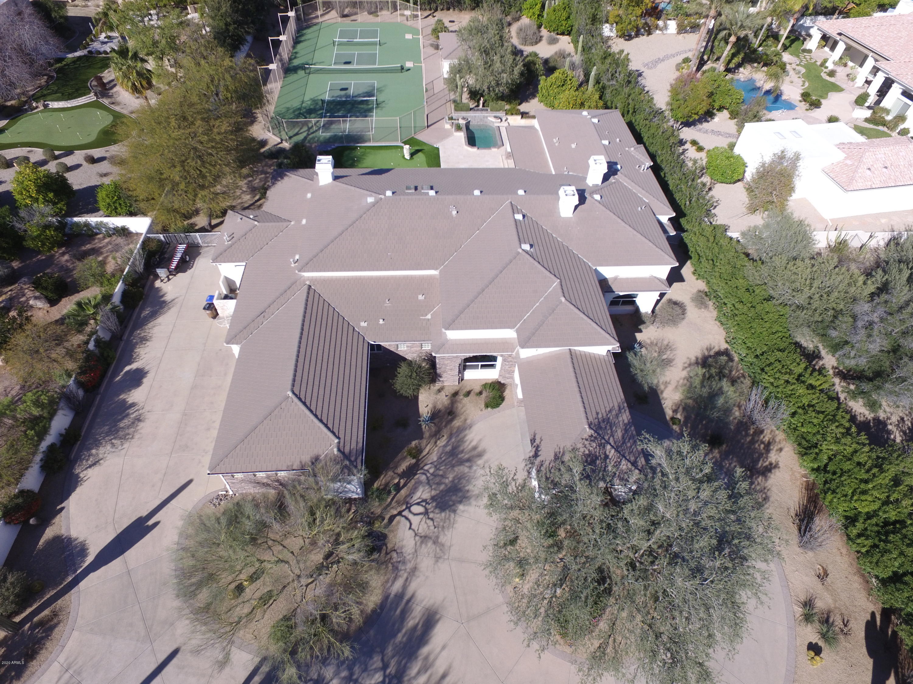 Location! Location! Location! And yes there is more! This meticulously maintained one owner estate is privately gated and sits on nearly 1.5 acres in Paradise Valley. Close to: amazing restaurants & shopping, multiple resorts including the soon to open Ritz Carlton, Spring Training Games, and the Loop 101 for easy access around the valley. This home boasts a master bedroom with 2 Lavatories, 2 closets, Sauna, Steam Shower, Sitting Room, wet bar, fireplace and an exercise room. Outside has 2 lighted Pickleball courts, a Ramada with a full bathroom, Putting green, and a huge Back Patio including a BBQ area. The home also has an oversized 3 car garage including 3 walk in storage areas with 1 having a/c. Come put your personal touches in this house and make it your Home!
