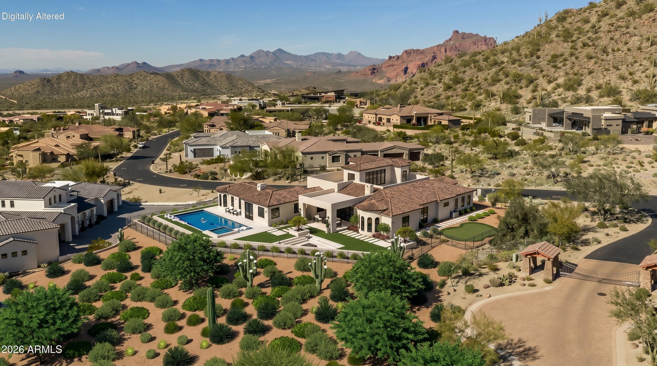 Commanding pristine panoramic views of desert and mountain vistas, including Camelback Mountain, Red Mountain and Usery Pass, this exceptional newly constructed home reimagines Spanish Revival architecture through a modern lens--crafted to meet today's conveniences and desires while honoring the romance of old-world design. 
Timeless elements such as arched passageways and windows, rich architectural details, and the use of natural materials are paired with a refined, updated aesthetic, while a welcoming front courtyard with breathtaking mountain views, intricate tilework and an outdoor fire feature create a warm first impression. Inside, a light-filled open layout reveals soaring ceilings and seamless indoor-outdoor living, all thoughtfully designed to showcase the home's breathtaking surroundings. The Chef's kitchen is appointed with a 30' Sub-Zero Refrigerator, 30' Sub-Zero Freezer, Wolf wall ovens, beverage refrigerator and a Pitt integrated gas cooktop.  Designer-selected white oak cabinetry and an oversized island accented by a visually stunning copper hood element blend performance with thoughtful design. A fully finished butler's pantry offers added counter and storage space perfect for culinary adventures and organization, and a main-level walkout deck just beyond the kitchen is the perfect place to dine al fresco or to add an outdoor kitchen.
A curated mix of wood, stone, and distinctive tile flooring adds warmth and texture throughout, while integrated smart home technology and energy-efficient systems deliver seamless, elevated living. The great room and adjacent living area share a dual-sided gas fireplace, offering the best of both worlds- open living spaces and a more private 'sanctuary' for living and entertaining. Glass slider doors connect to the expansive covered patio as it overlooks the lush desert surroundings beyond.  Imagine a back yard retreat with a stone-paved patio, desert landscape and dramatic evening lighting leading the way to a heated pool and spa, providing a serene setting to unwind while taking in the surrounding desert and mountain views. 
The primary suite offers a private retreat with a spa-inspired bath, pass-through shower with floor-to-ceiling tile and expansive walk-in closet. In another wing, guest quarters include a kitchenette, private bath, and separate entrance to the front courtyard--ideal for extended stays.
A grand staircase wraps around a private elevator that connects all levels, leading to an upper-level wellness retreat complete with a wet bar and powder bath. Expansive elevated decking extends the living space outdoors, creating an extraordinary vantage point to take in sweeping views and unforgettable Arizona sunsets--perfect for both relaxation and elevated entertaining. At the heart of the home on the main level is an open-air outdoor atrium with another intimate fireplace and a private staircase to the upper and bottom levels 
The lower level expands the home's versatility with a spacious garage offering 5 parking spots and storage, a media room/wine room which is pre-wired for customized temperature control, and an additional bedroom or secondary office--with a private entrance that creates a true away-from-it-all retreat within the home.
Blending old-world charm with modern refinement, this residence delivers an elevated living experience defined by design, comfort, and unforgettable views.  The home is ideally located just a few hundred feet from the Las Sendas Golf Course, a top rated-golf course that is recognized as one of the East Valley's premier desert courses, known for dramatic elevation changes, pristine fairways, and unforgettable Red Mountain views. 

Las Sendas is also celebrated for its active outdoor lifestyle, offering golf, pickleball and tennis courts, a private clubhouse, fitness center, multiple community pools, and miles of scenic walking/biking and hiking trails and parks woven throughout the community.  Las Sendas of Northeast Mesa is adjacent to the Tonto National Forest, featuring dramatic vistas and recreational activities like mountain and road biking, hiking, paddling/kayaking, boating, birding and more... yet it is an easy drive to downtown Scottsdale, Phoenix or Sky Harbor Airport.