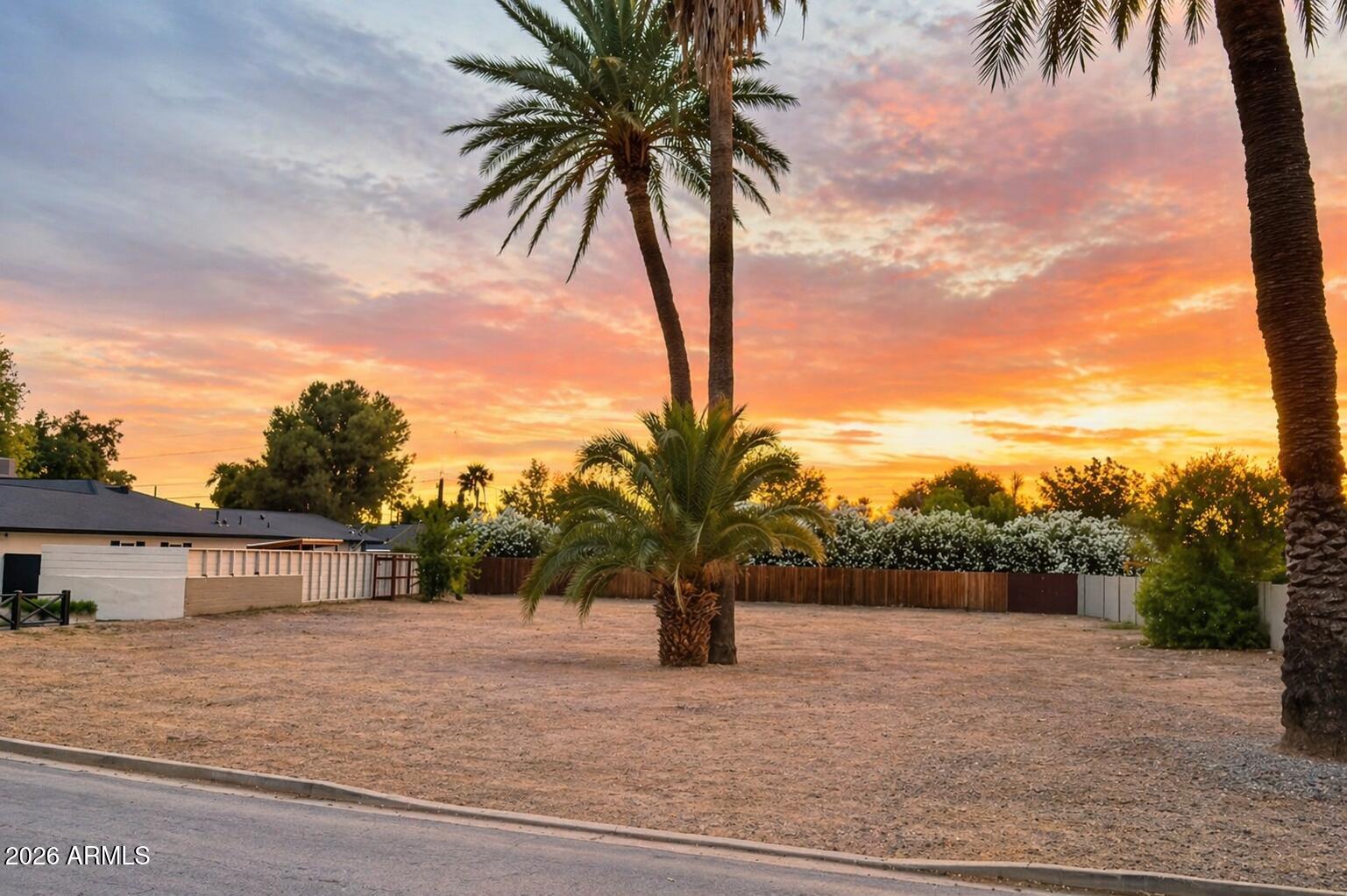 Rare oversized lot in the heart of Arcadia Ingleside neighborhood. Nearly double the typical lot size at just under 17,000 SF, this pristine, flat parcel is surrounded by stunning multi-million-dollar homes on a quiet, highly desirable street.
Already cleared and ready to build, this is a true blank canvas for a custom luxury residence--no demo, no hassle, just opportunity.
Enjoy mountain views in one of the most sought-after locations in Phoenix. Close to Arcadia's best dining, shopping, and lifestyle amenities, yet tucked away in a peaceful pocket.
