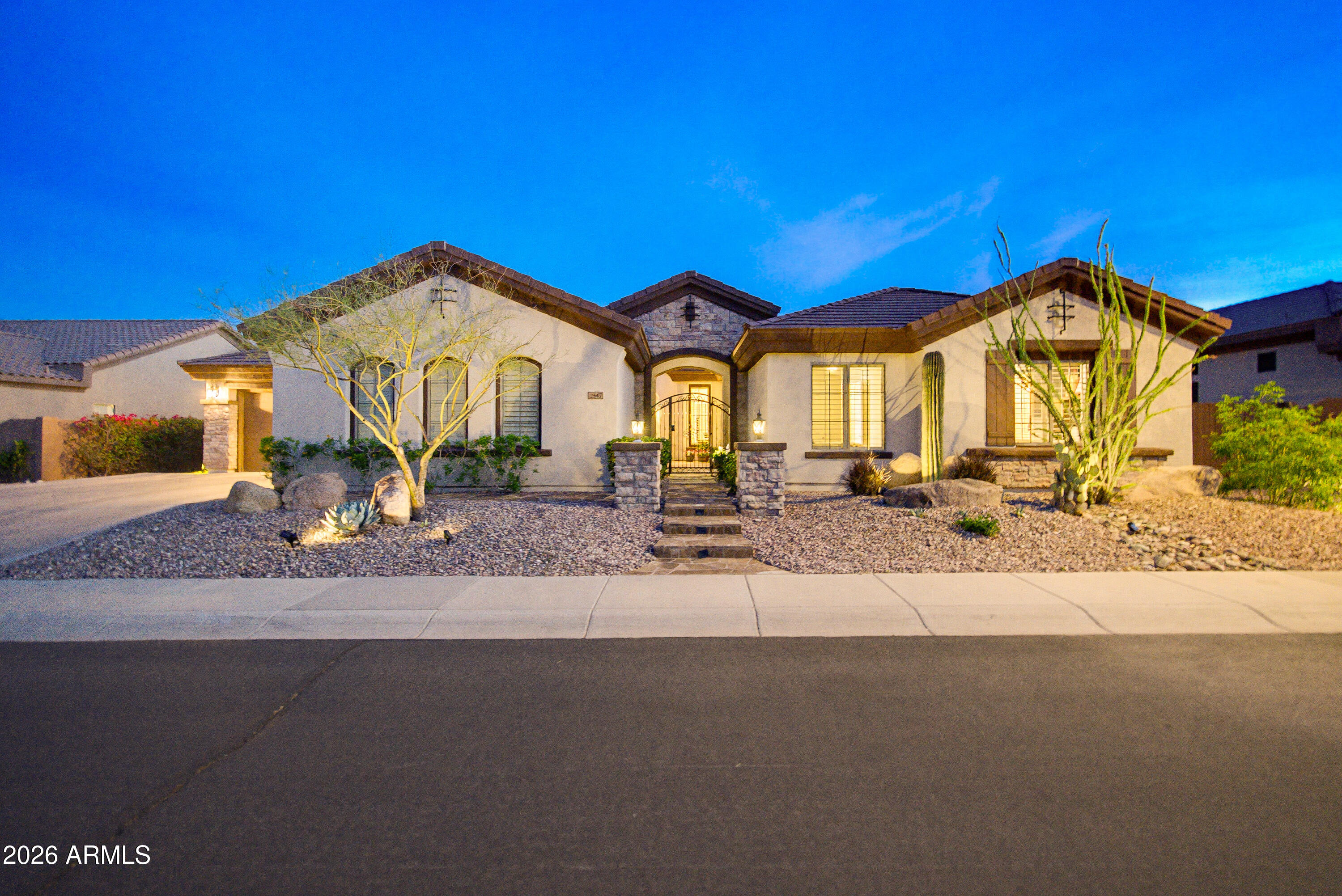 Beautifully remodeled Hampton model located in the prestigious Anthem Country Club. This exceptional residence offers 5 bedrooms, a den, and 4.5 baths, including a private casita with a full bath located just off the courtyard. With its own separate entrance, the casita offers ideal flexibility as a guest suite, home office, or private retreat. The dining area has been thoughtfully remodeled to create a spacious, light-filled living environment while still accommodating a formal dining space if desired which is perfect for both entertaining and everyday living. Large custom French doors added to the great room extend the living space outdoors, seamlessly blending indoor and outdoor living. Luxurious bathroom renovations were completed in 2025 elevate the home with refined modern finishes throughout. The home features two new 5-ton Trane HVAC units installed in 2024. The gourmet kitchen showcases upgraded custom cabinetry and elegant quartz countertops, complemented by Monogram double ovens with a warming drawer, a Wolf gas cooktop, Monogram refrigerator, Thermador dishwasher, prep sink, and a spacious walk-in pantry. Designed for resort-style living, the backyard features a sparkling pool and spa, built-in gas BBQ, stunning outdoor fireplace, and a raised gas fire pit with comfortable seating creating the perfect setting for effortless indoor-outdoor entertaining.  Come enjoy all that the Anthem Country Club has to offer. Located at the base of Daisy Mountain, Anthem Golf & Country Club is a guard-gated community that offers 36 holes of championship golf designed by Greg Nash plus two full golf practice areas.  You will also find 2 private clubhouses with dining and workout facilities along with 2 swimming pools. As a Country Club resident, you also have access to all the amenities of Anthem Parkside which include a 63-Acre park, game fields, Big Splash Water Park, Olympic-sized swimming pool, large workout facility, rock climbing, pickle ball, plus a catch and release lake plus so much more!!