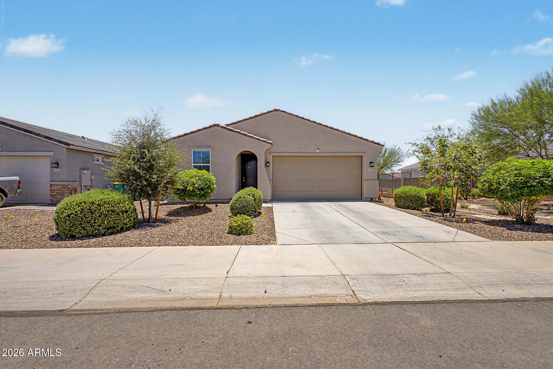 Built in 2023, this beautifully designed 3-bedroom, 2-bath home offers 1,590 square feet of modern living in the highly sought-after Trails at Tortosa community. The open-concept floor plan is filled with natural light & features soaring 9-foot ceilings, 8-foot interior doors, & a spacious great room that flows seamlessly into the kitchen. The upgraded kitchen showcases granite countertops, white cabinetry, stainless steel appliances, a large center island, & ample storage--perfect for entertaining & everyday living. Additional features include two-tone interior paint, a gas water heater, & Century Communities' Smart Home package. Situated on a desirable north/south-facing lot next to a walking path, this home offers added privacy & scenic views. Enjoy Arizona outdoor living with an extended covered patio and low-maintenance yard. Residents of Trails at Tortosa enjoy exceptional community amenities, including a resort-style pool, state-of-the-art amenity center, pickleball courts, playgrounds, walking paths, greenbelts, and a beautiful community lake. This move-in-ready home combines modern comfort, thoughtful upgrades, and an outstanding lifestyle opportunity.