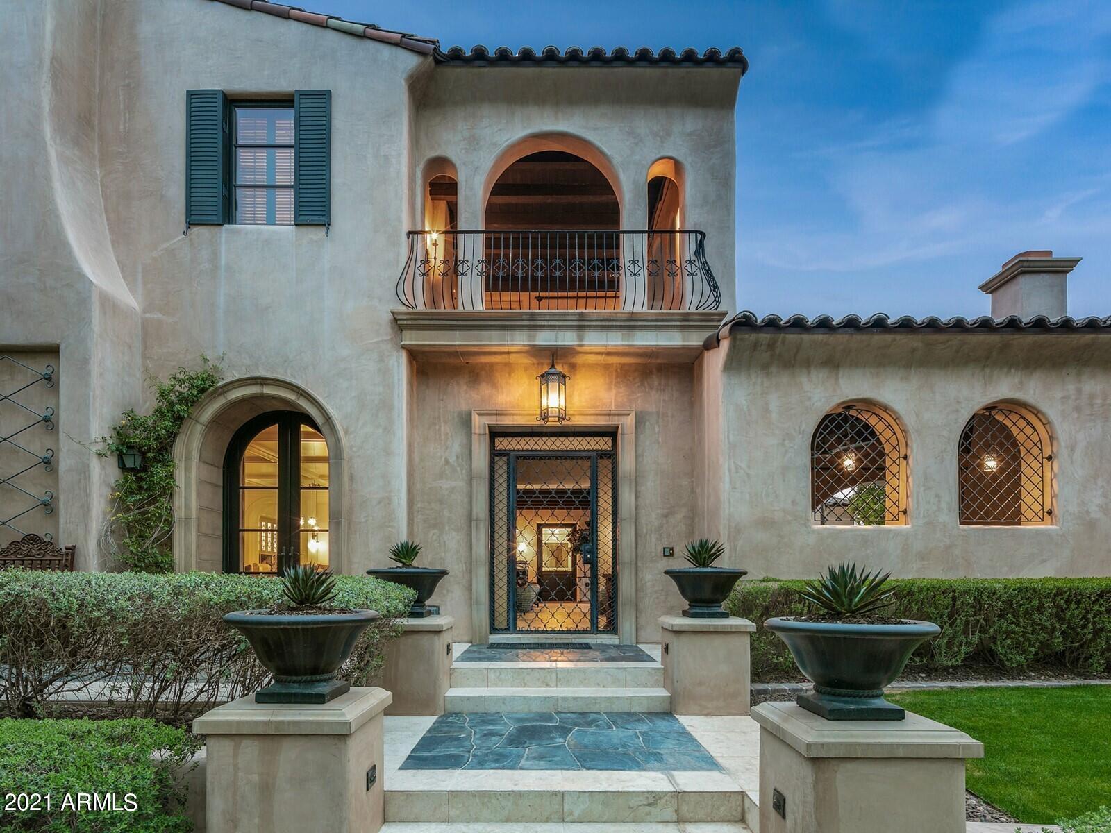 The Hamptons meets Scottsdale...Rare lake front home in Silverleaf! As one of only a few homes that overlook the fully stocked lake and expansive lawns of Desert Spring Park located in Windgate Pass in the exclusive Silverleaf community, this stunning two-story home offers water, mountain, city lights, and garden views from every window and 4 enclosed balconies. Sellers engaged the renowned interior designer Kim Scodro to remodel which included adding an 1,800-bottle wine cellar, dumbwaiter elevator, and many other elegant updates! Sophisticated chefs' kitchen with huge island, hand crafted cabinetry, and walk-in butler's pantry. 4 spacious en-suite bedrooms upstairs, including the master with a peaceful sitting area, spacious bathroom with steam shower and huge walk-in closet with laundry facilities.  Comfortably entertain in the fabulous bar located next to the walk-in wine cellar with an additional two wine frigs, dishwashers and auto shades. Host guests in the beautiful two room guest casita with fireplace and cozy sitting area.  Potential 8 car garage and air conditioned!!!  Spectacular outdoor entertaining area features pool and spa, kitchen area, covered patio, and enclosed outdoor bathroom. So many thoughtful details, this gorgeous home is a must see!