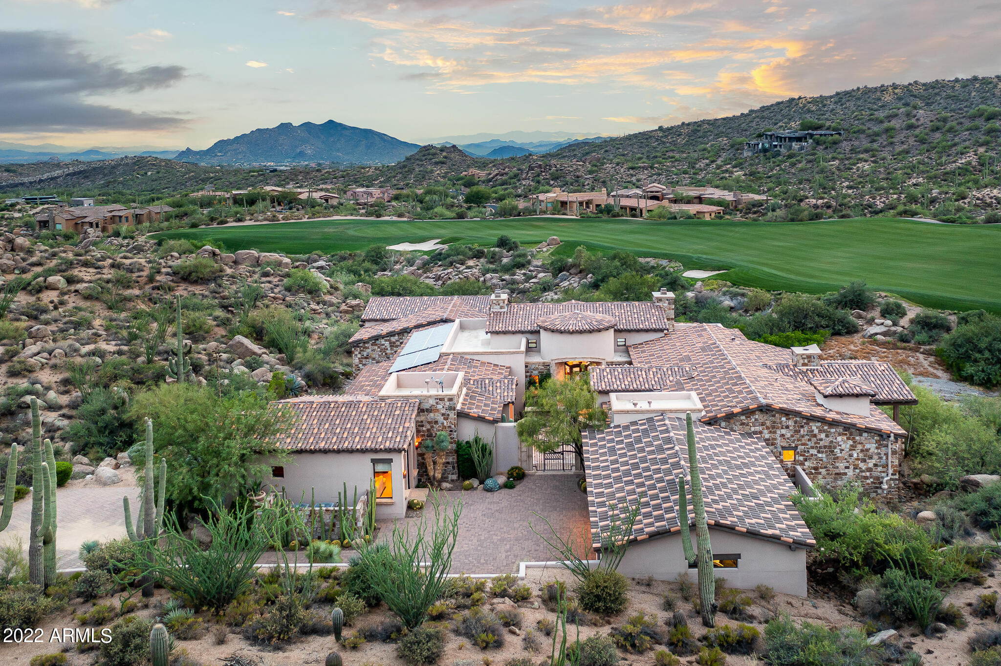 Stunning home sits on almost 3 acres w/Southwest orientation overlooking the 15th fairway of Chiricahua w/mountain, boulder cropping & city light views. Designed & built by the duo architect Bing Hu & builder Dave Reese of Platinum homes in 2006. Renovation & addition in 2013 supervised by Platinum homes. The architect created a perfect floor plan w/separate master wing including dedicated office & hidden gym. Guest wing has 2 spacious en-suite bedrooms. Additional 700 sq ft attached 2 room casita w/outside & inside access. Kitchen w/high end appliances, including 2 dishwashers, & large Wolf Range. Great Room w/telescoping door. Family room boasts 2  retractable doors, game room, & full bar opening to indoor/outdoor living. Lower level family room w/4 built-in bunk beds. You will enjoy the outdoor living with multiple patios, one with electric heaters for cool nights, a heated infinity edge pool with a Baja ledge for lounging, a separate heated spa and a built-in BBQ center with both a Traeger smoker and gas grill. To top things off, this home comes with a golf  membership so you can start enjoying the world class  golf and lifestyle community of Desert Mountain immediately upon closing!