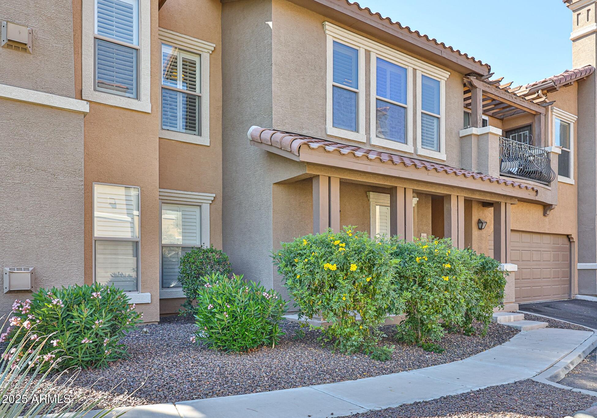 Discover this rare North/South facing 3-bedroom, 2-bathroom condo in the highly sought-after Renaissance Villas in Litchfield Park. This home includes a two-car garage and two spacious balconies, both with beautiful mountain views! Inside, the open-concept kitchen and living room create an inviting atmosphere, complete with a cozy gas fireplace--perfect for relaxing or entertaining. Beyond your front door, indulge in resort-style amenities, including a clubhouse/rec room, fitness center, and a heated pool and spa-ideal for unwinding year-round. HOA even covers water/sewage, garbage collection and fireplace fees!