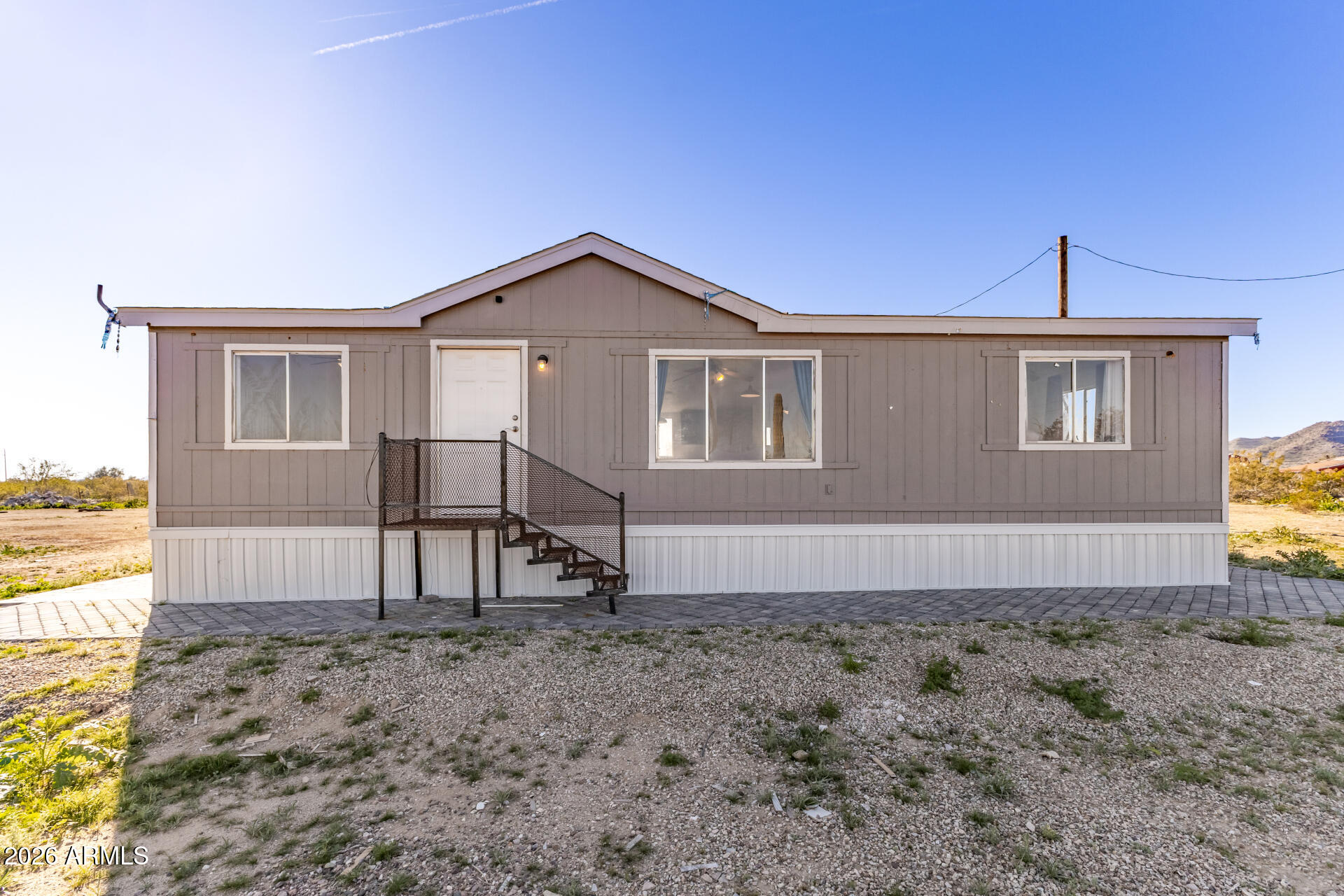 Have you been thinking of living out in the country? Think no more! This beautiful 3.3-acre property offers stunning mountain views with wide open space and is zoned for livestock, horses, chickens, goats...providing ample space for corrals, barns, and more. It offers the perfect balance of peace and quiet away from the city with convenient access when needed. The home has undergone extensive renovations in 2025, including:
New pavers installed around the entire home, Updated roof, New flooring throughout, New kitchen cabinets, outside of house painted and many other upgrades. don't miss your chance to own a slice of beautiful Arizona