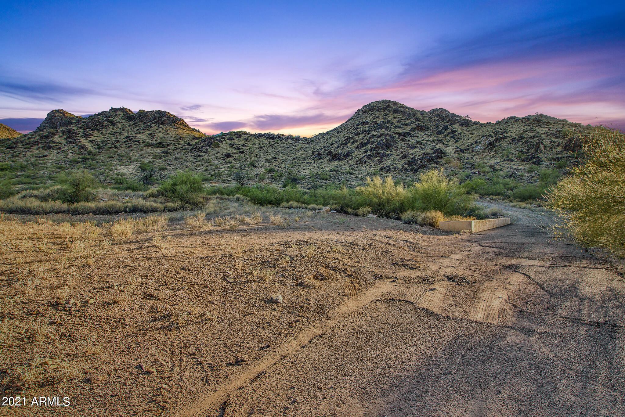 Tucked away on the northeastern flank of Mummy Mountain, a remarkable 5-acre lot awaits, offering a unique blend of secluded luxury and awe-inspiring panoramas. This property stands as a rare jewel in the realm of high-end real estate, beckoning discerning buyers with its promise of exclusivity and breathtaking natural beauty. The lot's most striking feature is undoubtedly the 180-degree views it commands of the majestic McDowell Mountains and the storied Red Mountain. Each daybreak and dusk here is a visual symphony, with the skies above painting ever-changing hues that enchant and inspire. Perched on the slopes of Mummy Mountain, the property guarantees these views remain unobstructed, setting the stage for a home that's one with the serene desert sky. Accessibility to this private is via a discreet driveway, ensuring that seclusion and exclusivity are paramount. While it offers a retreat-like ambiance, far from the frenetic pace of city life, the property is conveniently located just minutes away from the heart of Paradise Valley & Scottsdale. Here, tranquility meets accessibility, making it an ideal sanctuary for those who value peace yet appreciate the proximity to urban amenities. The expansive 5-acre spread is a canvas awaiting your vision. It's a rare opportunity to construct a custom home as grand as 40,000 square feet, tailored to your unique tastes and lifestyle. Whether your dream is a sprawling, opulent estate decked with every modern luxury or a more understated abode that complements the surrounding desert, this property can accommodate it. The ample space offers endless possibilities, from a large main residence to large underground garage spaces, a private resort-style pool, and lush outdoor living areas. Beyond a mere residence, this property represents a legacy, an investment in one of Scottsdale's most sought-after locales. Its combination of size, location, and potential marks it as a rare find in the real estate market, poised for significant appreciation in value. The previous home was removed on this lot which means much of your pad preparation has already been completed offering a savings of many thousands and allows your architectural aspirations to face no boundaries. Whether your preference leans towards a sleek, minimalist design that frames the desert vistas or a Mediterranean villa that seamlessly melds into the surrounding terrain, your dream home can become a reality here. Envision hosting elegant gatherings where guests are captivated by the stunning vistas, enjoying outdoor meals beneath the starlit sky, or simply relishing the tranquility of your desert haven. The property's scale and unique location make it ideal for both lavish entertainment and intimate family life. In summary, this 5-acre lot on Mummy Mountain is more than just a parcel of land; it's a gateway to creating a personal sanctuary, a family stronghold, and a home that will stand as a testament to your vision and taste. Its combination of breathtaking views, privacy, and boundless potential offers an unparalleled lifestyle for those seeking the pinnacle of Scottsdale living. This property isn't just a place to live; it's a canvas for dreams, a foundation for memories, and a cornerstone for a legacy that will endure. ALTA Survey completed within the past 2 years available on request