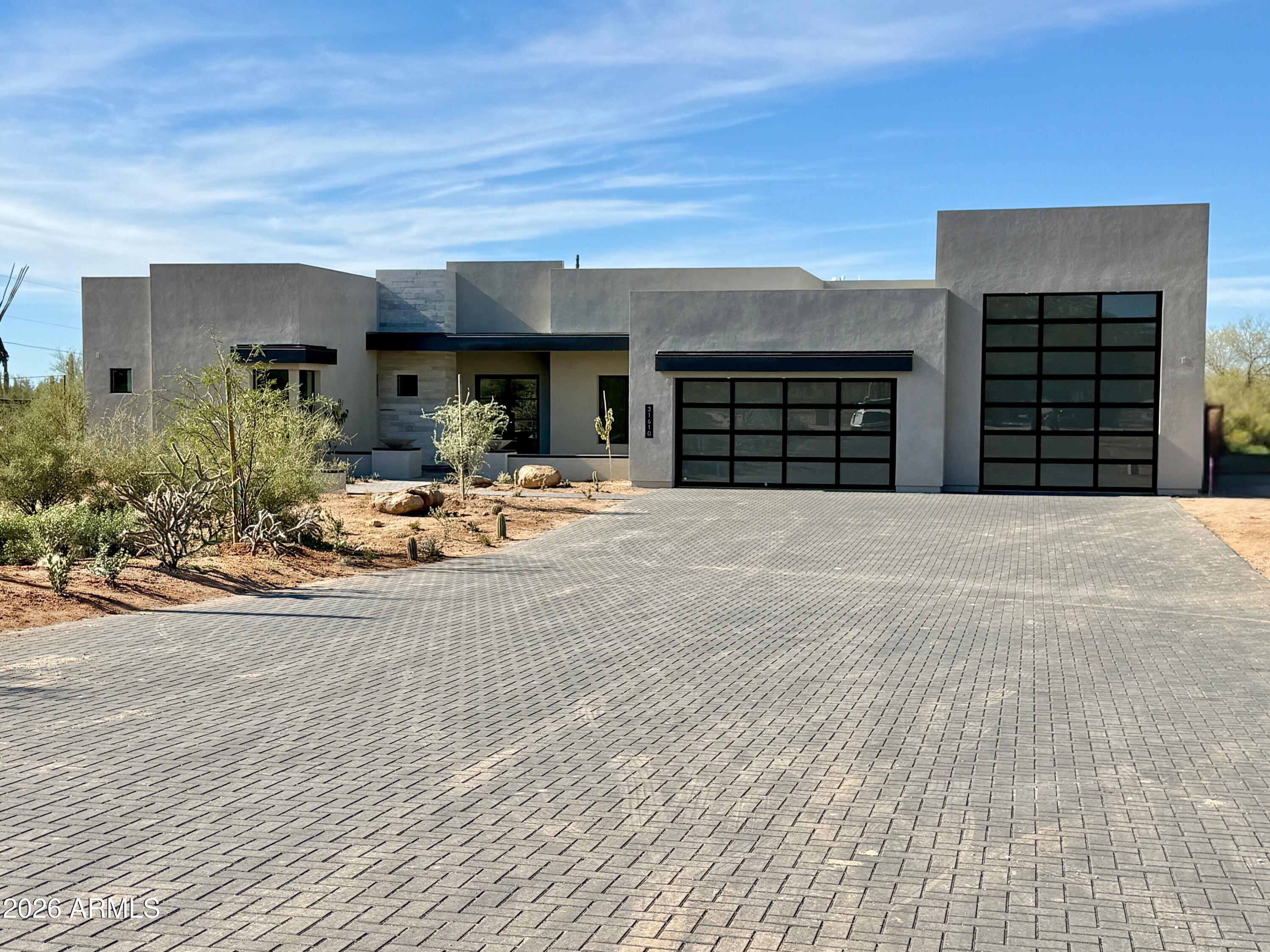 Luxury new construction on a private one-acre lot featuring the Sedona plan with pool house, designed for exceptional entertaining. Main home offers 4 bedrooms and 4.5 baths. Pool house includes 2 bedrooms and 1.5 baths, with the half bath serving the pool and backyard. Resort-style yard features pool with swim-up seating, hot tub, Ramada, sport court, and three putting greens. Exceptional upgrades and finishes throughout, including waterfall island in the kitchen with Wolf/Sub-Zero appliances, wine fridge, and great room fireplace. Spa-style owner's suite with double-entry shower, soaking tub, floating vanities, and private washer/dryer in the large closet. Quality- 2x6, Spray foam Insul., Post tension Foundation. Ideal for auto and RV enthusiasts with a 3-car tandem garage and RV garage