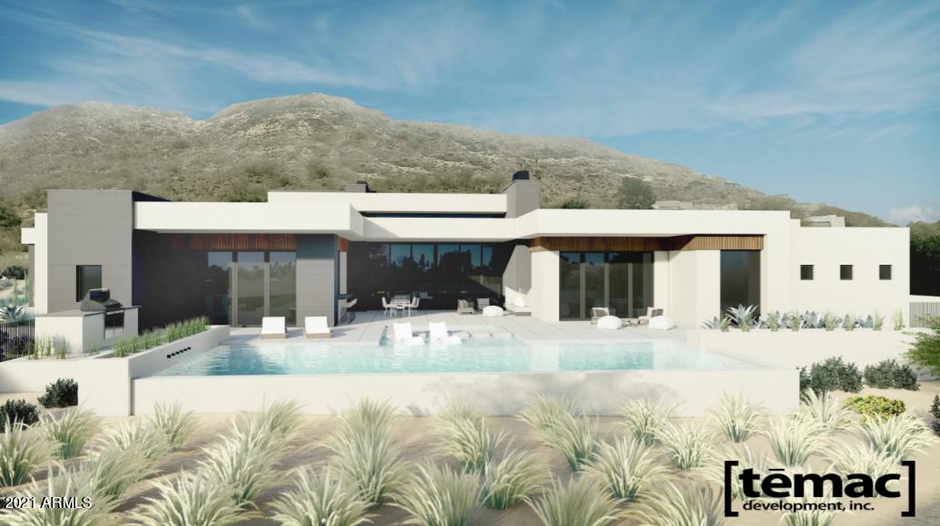 Throned along Mummy Mountain, the only thing more beautiful than this property's iconic view of Camelback Mountain is its warm contemporary floor plan perfect the resort lifestyle.  Designed with intention, luxury meets comfort strolling between stunning livable spaces, a sprawling patio and pool complete with a pass through bar and grilling area and 3 designated workspaces for the new era. Interiors are spectacular with walnut cabinetry, walnut interior doors, giant walls of glass all flooded with natural light. Temac Development continues to define what Paradise Valley custom living can be in this 7015 sf private residence, complete with a full detached guest house. Ready for occupancy in the Winter of 2021.