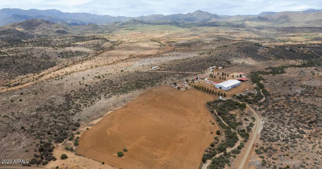 There are four wells located on the property

The site has one main house and four smaller homes. (1400sqft Main House)

Over 60,000sqft of covered horse facilities. 
Includes an enormous indoor covered show ring 36,000sqft, an outdoorshow/roping ring, two paddocks for horses, a hot walker and open land available for growing feed for crops

In Mayer, the summers are hot, dry, and mostly clear and the winters are cold and partly cloudy. Over the course of the year, temperatures vary from 31°F to 92°F and are rarely below 23°F or above 99°F.

70 miles north of Phoenix