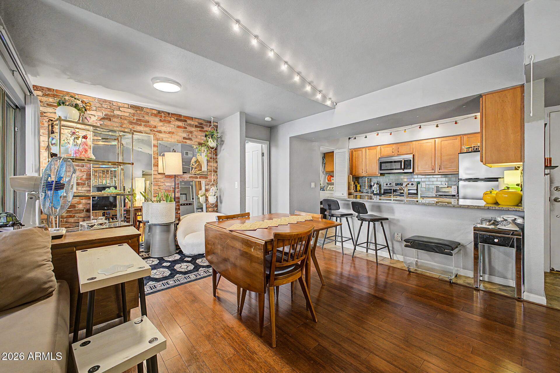 Investor opportunity in the heart of Tempe! Tenant-occupied 2 bed / 2 bath condo providing immediate rental income with optimized mid-term rental upside potential. This unit features a highly desirable split floorplan, inside laundry, a private shaded balcony, and spacious living areas. Unbeatable location just 2.5 miles from ASU, shopping, dining, major valley employers, and immediate freeway access. An attractive option for buy-and-hold investors, 1031 Exchange buyers, and portfolio growth. Active HOA community repair projects offer a built-in equity cushion and long-term value enhancement. Dues cover exterior maintenance, roofing, blanket insurance, water, sewer, trash, and access to 2 heated pools and hot tubs. Buyer to independently verify all property rules. Highest & Best Use Strategy: While currently stabilized as a long-term rental, this asset is primed for an optimized roadmap to transition into a premium 30-to-90+ day Mid-Term Rental (MTR) to capitalize on high-yielding traveling medical, corporate, and transitional academic stays. Financing & Cash Advantage: Due to ongoing community asset stabilization and repair cycles, this property is currently non-warrantable and requires an all-cash close. Cash investors can capitalize on this status to bypass financed retail competition. Turnkey Rental Infrastructure: Property is situated in an always-in-demand rental hub with local property management infrastructure available for seamless out-of-state portfolio integration. Pro Forma Availability: Data-backed pro forma models outlining both the stabilized long-term rental math and optimized mid-term rental metrics are available upon request.