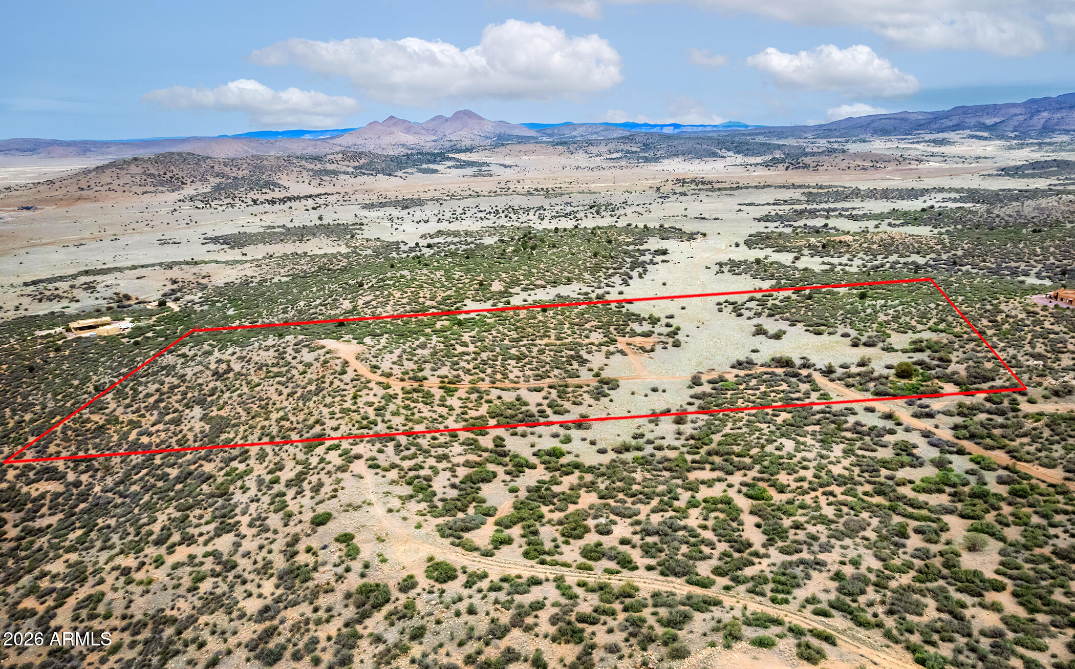 PRESCOTT RIDGE, the Best Kept Secret in the Quad Cities, has 10 Acre minimums, is GATED, with PAVED Access to most lots, & VIEWS are abundant!!!!!  Parcel Borders STATE TRUST LAND to the North....parcel has 21.77 acres, 3 wells (yields unknown), and the building site is very Private & has VIEWS.