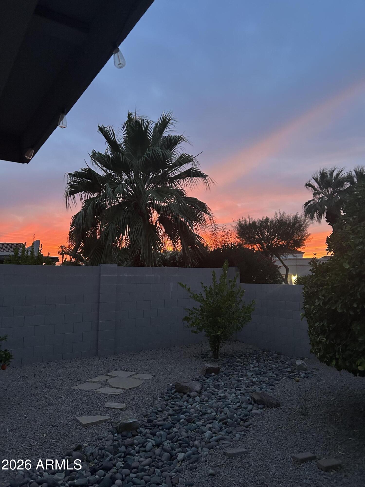Experience refined desert living in this beautifully updated home nestled on a corner lot in the highly sought-after Sun Lakes community. This spacious home offers 2 bedrooms, 2 bathrooms, plus a versatile bonus room--perfect for a home office, hobby space, or guest retreat. Step inside to discover stylish wood laminate flooring and an updated kitchen designed for both functionality and entertaining. The thoughtful layout flows effortlessly into an expansive wraparound backyard patio, ideal for relaxing evenings or hosting gatherings while enjoying Arizona's indoor-outdoor lifestyle. Practical upgrades provide peace of mind, including a newer roof (approx 5 years old) and a recently updated A/C system (2 years old). Car enthusiasts and golf lovers alike will appreciate separate garages!