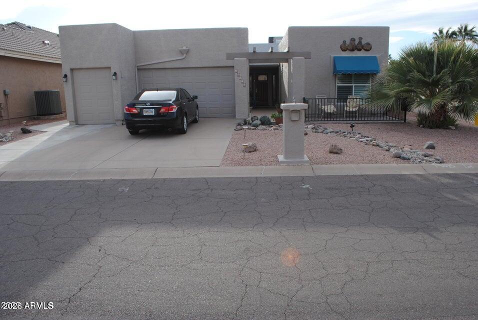 Experience refined desert living in this beautifully updated home nestled on a corner lot in the highly sought-after Sun Lakes community. This spacious home offers 2 bedrooms, 2 bathrooms, plus a versatile bonus room--perfect for a home office, hobby space, or guest retreat. Step inside to discover stylish wood laminate flooring and an updated kitchen designed for both functionality and entertaining. The thoughtful layout flows effortlessly into an expansive wraparound backyard patio, ideal for relaxing evenings or hosting gatherings while enjoying Arizona's indoor-outdoor lifestyle. Practical upgrades provide peace of mind, including a newer roof (approx 5 years old) and a recently updated A/C system (2 years old). Car enthusiasts and golf lovers alike will appreciate separate garages!