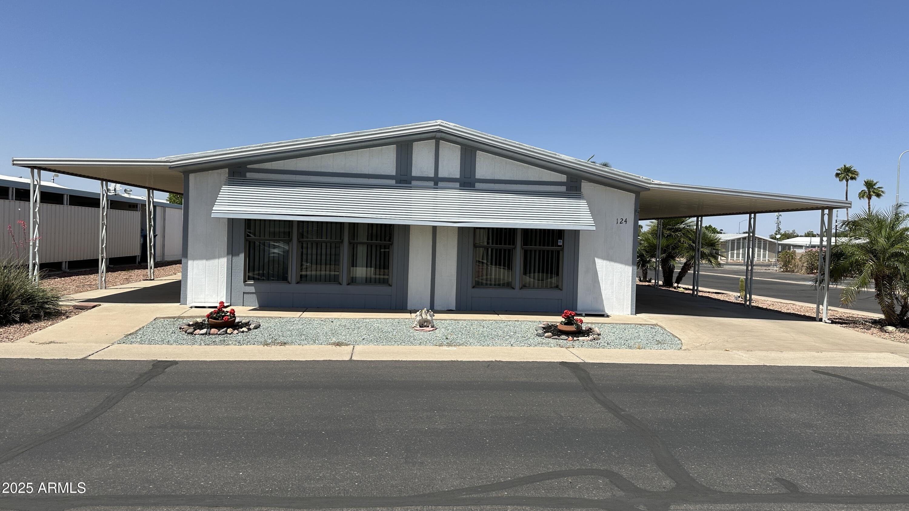 One of the standout features is the rare dual-driveway setup -- no more moving vehicles just to get in or out, with plenty of room for cars, a golf cart, and all your recreational toys. Step into comfort, convenience, and breathtaking views in this charming 2-bedroom, 2-bath home located in a sought-after active 55+ gated community!   Inside, you'll love the beautiful new flooring that brings a fresh feel while still preserving some of the home's original character and charm. 
Enjoy your morning coffee or evening sunsets from the spacious covered patio while taking in stunning mountain views and Arizona sunsets. There's even a dedicated workshop, perfect for hobbies, projects, or extra storage. This is more than just a home -- it's the freedom, security, and active lifestyle you deserve!