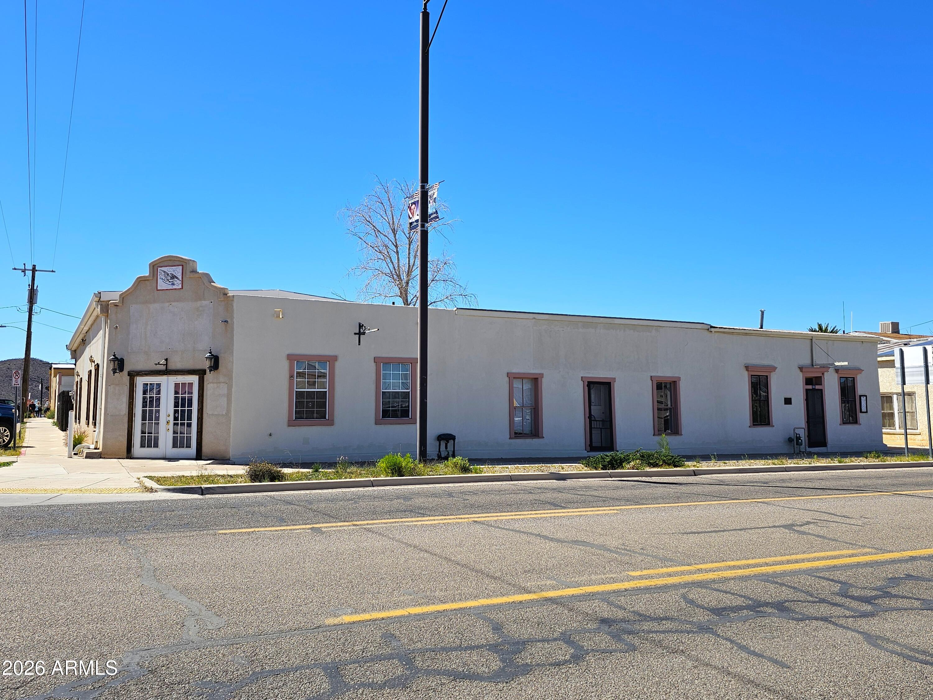 This exceptional multi-use property offers a rare blend of commercial and residential space. The retail portion of the building, constructed in 2003, features a two-car roll-up door for convenient loading and deliveries. Attached to it is the original structure, built in 1882 from adobe, which is currently used as a residence. The property includes owned solar to help reduce operating costs. The residence is equipped with several gas fireplaces and ceiling  throughout, providing year-round comfort. It offers excellent versatility with two rooms currently used as bedrooms, 2.5 bathrooms, and four ''parlor'' rooms that can serve a variety of purposes. Additional highlights include beadboard ceilings, original oak floors, and an upgraded kitchen with porcelain flooring and a gas stove. Please note that, as a historic building, there are restrictions on permitted uses and renovation activities.