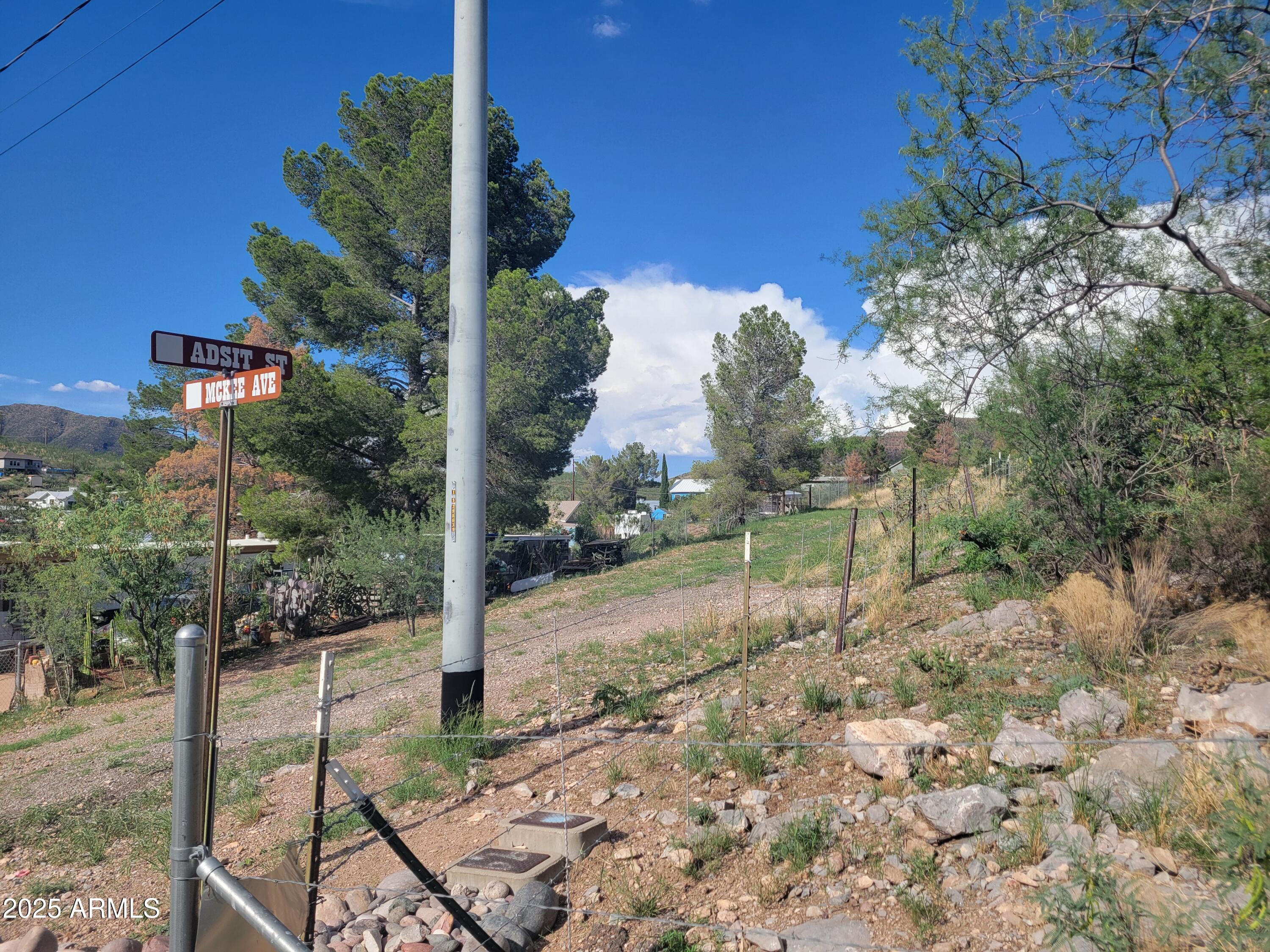 4.3 acres located on county line in Warren. Hillside elevation with beautiful natural vegetation and equally beautiful views. The acreage has been surveyed and is a portion of Parcel 10112041C. The parcel had not yet been recorded for it's own parcel ID but is identified as Lot 3 on the survey. City water is available at the corner of Adsit and McKee. Power pole is next to the water meter and sewer line available nearby. Buyer to determine all facts and figures.