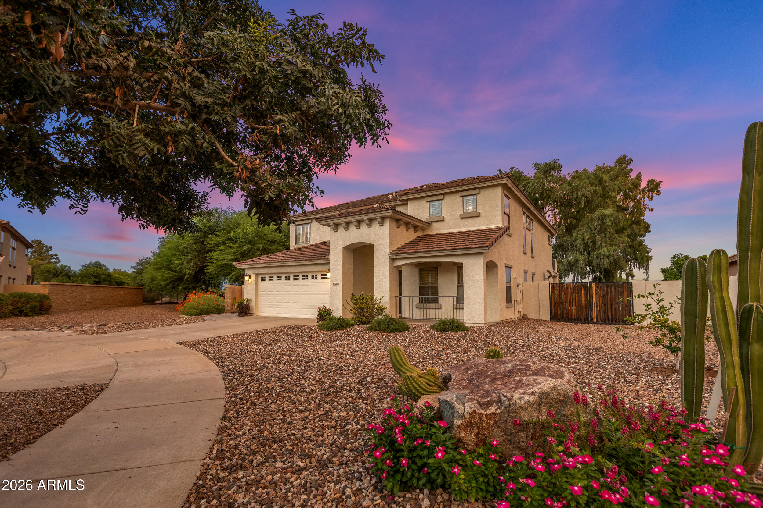 Your new home sits on one of the most spectacular golf course lots in Queen Creek. 

You are tucked away on a quiet cul-de-sac with breathtaking fairway views you'll enjoy every single day. 

You're just minutes from the golf clubhouse, popular shopping at Queen Creek Marketplace with Target, Trader Joe's, Kohl's, TJ Maxx, J.Crew Factory and more, plus the Queen Creek District featuring HomeGoods and Sprouts. 

Have a romantic dinner at Social Birdie overlooking the course, enjoy lunch at the Queen Creek Olive Mill, or spend an evening exploring the many local restaurants, boutiques and entertainment options that have made Queen Creek one of Arizona's most sought-after communities. Everything you need is just minutes away. Imagine starting your morning with coffee on the balcony overlooking the fairway, watching the sunrise while the course comes to life, and ending your evening relaxing in your stunning 2024 custom pool and spa. Complete with ambient lighting and fire bowls.

Designed for entertaining, your backyard features elegant fire bowls, colorful pool lighting, and premium cleaning systems, including a top skimmer robot and bottom cleaner robot, so you can spend more time enjoying your backyard and less time maintaining it.

From the moment you walk through the front door, you'll notice abundant natural light, soaring ceilings, beautiful wood-look vinyl flooring, and an inviting floor plan designed for everyday living. 

Fresh, neutral finishes make it easy to design it to your style, and new memories fill every room.

The spacious eat-in kitchen is the heart of the home and offers built-in appliances, abundant cabinetry, generous counter space, recessed lighting, a huge walk-in pantry, and a large center island where family and friends naturally gather. Whether you're preparing a quiet dinner or hosting holiday celebrations, this kitchen was designed to bring people together.

Need flexibility? Your new home offers a highly desirable downstairs bedroom that can easily serve as a second primary suite. It's perfect for multigenerational living, long-term guests, a private home office, or anyone who prefers not to navigate stairs.

Upstairs, the spacious loft features built-in desks, creating the perfect homework station, study area, home office, or creative workspace. 

The primary suite is truly a retreat, featuring double-door entry, private balcony access overlooking the golf course, a beautifully updated ensuite bathroom with dual vanities, a soaking tub, separate shower, and a generous walk-in closet. 

Imagine ending each day on your private balcony with panoramic golf course views and Arizona's incredible sunsets.

Both upstairs bathrooms have been tastefully updated, giving the home a fresh, modern feel while maintaining timeless style. Every space has been thoughtfully cared for, making this home truly move-in ready.

Step outside and you'll quickly understand what makes this property so special. The backyard was designed to capture the incredible golf course views while creating an outdoor living space you'll use year-round. Whether you're swimming, soaking in the spa, entertaining friends, grilling on the covered patio, or simply relaxing with your favorite drink, this backyard feels like your own private resort.

Golf course homes with updated interiors, a newer custom pool and spa, flexible living spaces, and views like this rarely become available. If you've been waiting for a home that offers luxury, comfort, convenience, and an unforgettable Arizona lifestyle, you've found it.
