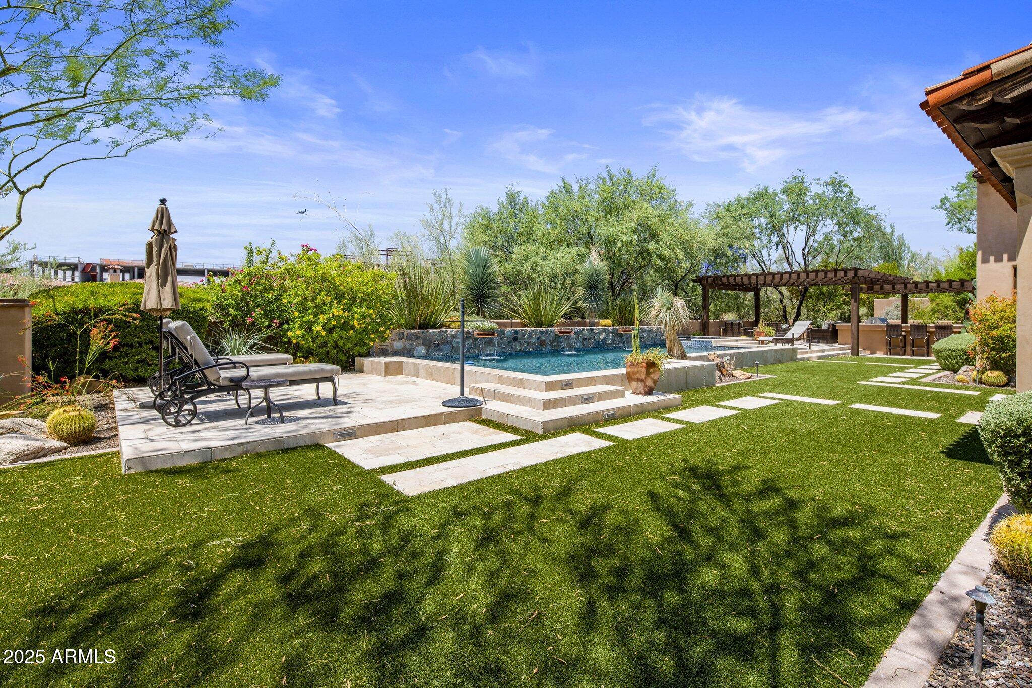 SILVERLEAF GOLF MEMBERSHIP OPPORTUNITY!

Timeless design and everyday elegance define this single-level residence in the coveted Horseshoe Canyon of Silverleaf. A private courtyard with bubbling fountain and sitting area creates an inviting first impression.

The great room sets a dramatic tone with its tongue-and-groove wood ceiling and pocketing doors that extend the living space to the outdoors. A chef's kitchen appointed with Viking appliances, granite counters, and an expansive butler's pantry with extra ovens and refrigeration makes entertaining effortless.

A handsome office with French doors to the courtyard offers both privacy and charm... ...while three ensuite bedrooms  including a serene primary retreat with spa-like bath and generous closet  provide comfort for family and guests.

Outdoors, the Arizona lifestyle comes alive with a sparkling pool, raised spa, fire features, and multiple covered patios ideal for dining al fresco or relaxing with mountain views. With a two-car garage and proximity to the Silverleaf Club, this home pairs sophistication with resort-style living.