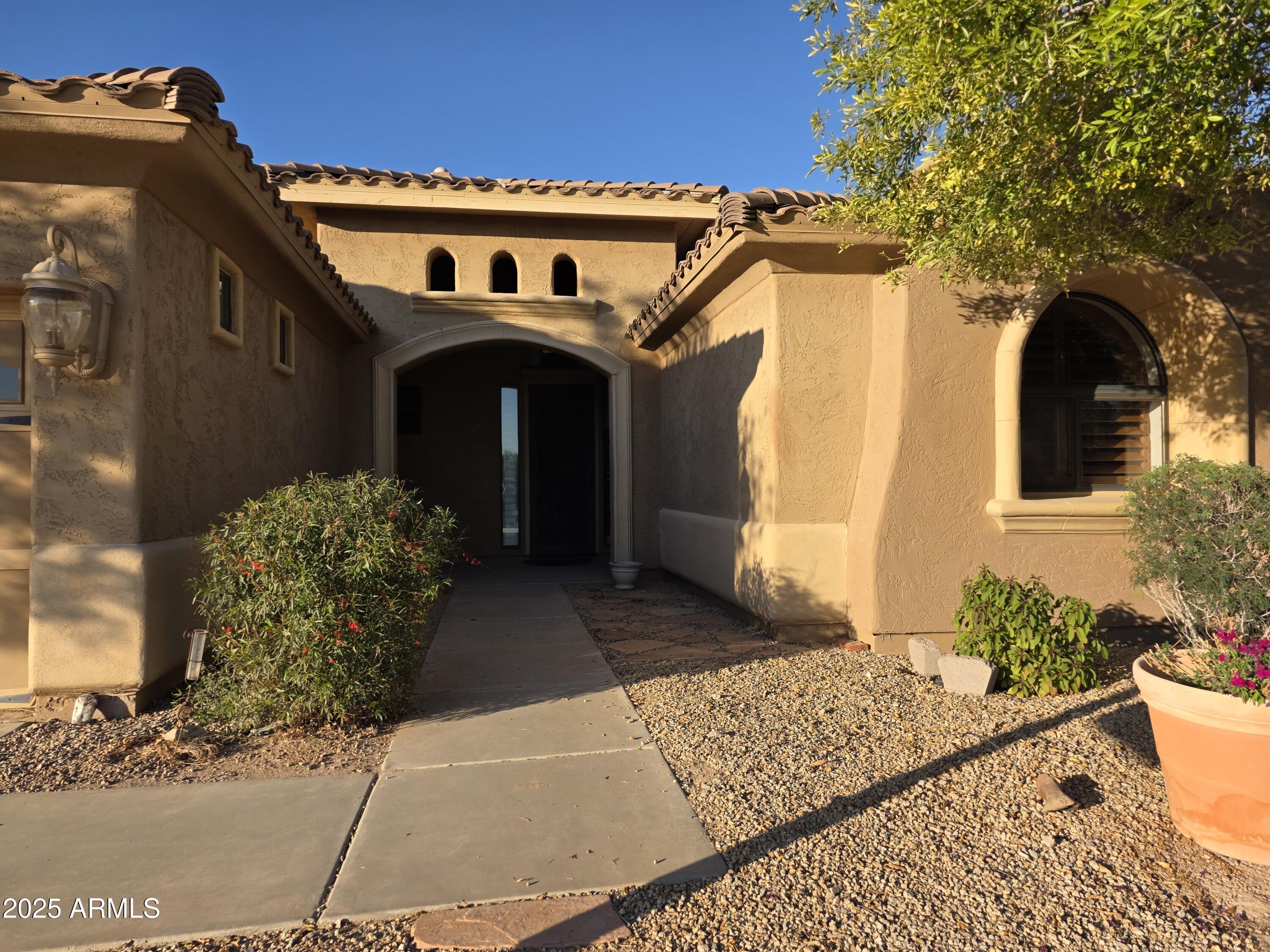 Beautiful custom home in a private gated community. This 3 bedroom 2 bath home features a spacious kitchen with granite counter tops, pantry, stainless steele appliances and plenty of cabinets, tile throughout, dining nook with bay windows, laundry room with granite countertop and sink. The living room has a  built in entertainment center with gas fireplace and opens up to the Private  backyard. The primary bedroom features plantation shutters, large walk in closet, double sinks, and a linen closet.