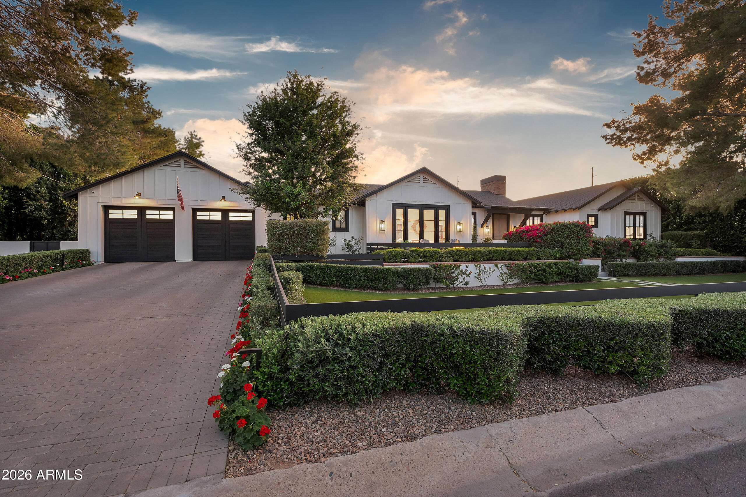 Located in the heart of Arcadia Proper, this beautifully crafted Vista General home known for exceptional quality and craftsmanship sits on nearly half an acre along one of the neighborhood's most charming streets surrounded by mature landscaping and updated homes. Inside you'll find soaring ceilings, real hardwood floors, two expansive great rooms, and a chef's kitchen with a large island, walk-in pantry, and Wolf and Sub-Zero appliances. The home offers five bedrooms, including a spacious primary suite, plus two offices and a bonus game room. The backyard is a private retreat featuring a resort-style pool and spa, fire pit, lush landscaping, and a beautiful ramada with fireplace and built-in barbecue kitchen area. A charming she shed adds flexible space for a studio or retreat. throughout the home. The chef's kitchen is the centerpiece of the home, complete with premium appliances, a large island, walk-in pantry, and elegant finishes that flow seamlessly into the open living spaces. Each bedroom features its own en-suite bath and walk-in closet, offering comfort and privacy for family members and guests alike. The backyard is a true Arcadia retreat, designed for year-round enjoyment. Enjoy a heated pool and oversized spa, expansive patio areas, lush landscaping, and a custom outdoor entertaining space with a barbecue island and gazebo--perfect for hosting gatherings or relaxing under the Arizona sky. Additional highlights include a three-car garage, smart-home features, mountain views, and close proximity to top local schools, all within one of Phoenix's most desirable neighborhoods.