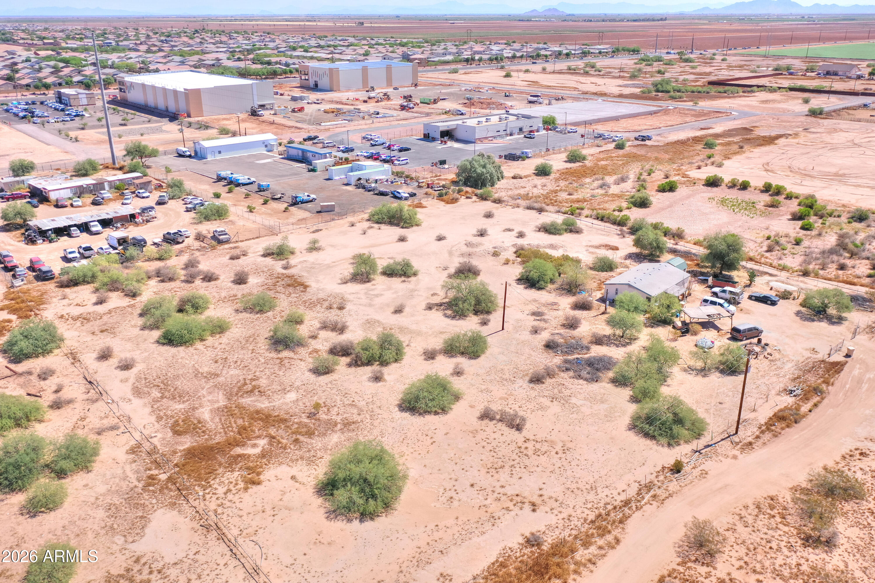 2.5 Acres with Utilities Already in Place - Great Opportunity in Seven Ranches, one of Maricopa's fastest-growing areas, with active commercial development underway nearby!

Discover the potential of this 2.5-acre property offering plenty of space for your future plans. The property features existing electric and water service, providing a valuable head start for development, a new homesite, or a recreational retreat.

A manufactured home is currently on the property and is included in the sale. The home is occupied and will be sold in as-is condition, with repairs needed. Pricing reflects the value of the land, which is supported by comparable sales in the area.

Enjoy the freedom and possibilities that come with owning 2.5 acres while benefiting from existing utilities