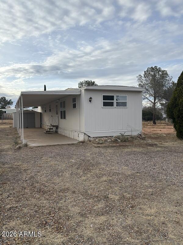 Bedroom 2 Bath single wide trailer in Golden Acres subdivision.  Nice open lot in a Cul-de-sac. Tool shed, new windows, carport, ceiling fans, evaporative cooler. The lot that the home is located is included in the transaction.  The HOA provides garbage service.  Home was recently painted, spare bath sink and washer hookups replaced