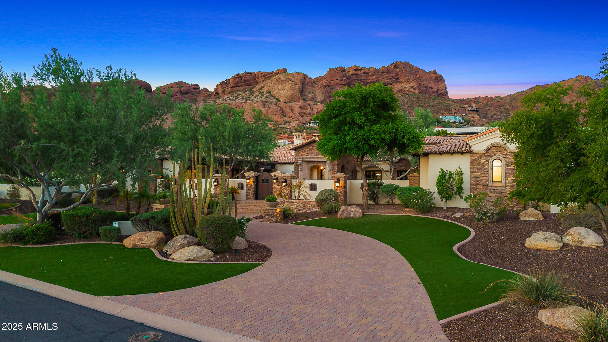 ** Priced below appraised value **
Experience the scale and privacy of a true Paradise Valley estate within the coveted Arcadia Hillside neighborhood. This exceptional property presents a rare opportunity to enjoy the acreage and seclusion typically reserved for Paradise Valley, while benefiting from the community feel and walkability that make Arcadia so desirable. Set on 1.5 acres, the main residence features a thoughtfully designed floorplan highlighted by an extraordinary 2,000 square foot primary retreat with two expansive walk-in closets. Each guest suite is generously sized with its own private bathroom, offering comfort and privacy for family and guests. A private 1,000 square foot guest house is attached to the main residence and includes a full kitchen, making it ideal for extended stays or live-in accommodations.
The main residence is accessed through a private gated drive that leads to a five-car garage. Built with block construction, the home offers superior insulation during the summer months while also minimizing exterior noise.
In addition to the main residence, the property features a completely detached structure offering remarkable versatility for the next owner. With more than 3,400 square feet under roof and its own private gated driveway leading to an additional five-car garage, this space is ideal for a private training and recovery facility, a luxury car collector's showroom, or a wide range of other custom uses.