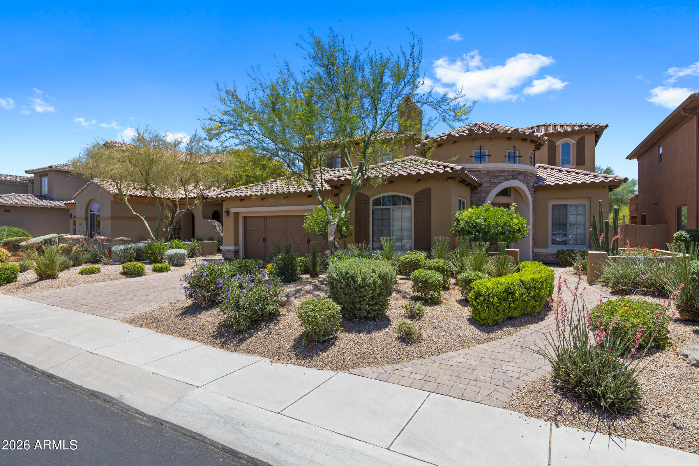 Stunning Toll Brothers semi-custom, former model home in the highly sought-after Village 2 at Aviano! This gorgeous 4BR/2.5BA, 3,084 SF residence sits on a well-appointed lot and showcases the quality craftsmanship Toll Brothers is known for. Enjoy multiple outdoor entertaining areas with an interior courtyard with fireplace, and a lovely patio with custom pool and spa and built in bbq.  Inside, you'll find a large family room with open kitchen that includes a built-in refrigerator and high-end appliances.  Separate living spaces allow for privacy and cozy conversations.  One bedroom downstairs with half-bath, remaining bedrooms are upstairs and include a shared bathroom between the secondary suites and a large primary suite with balcony.  Aviano is a coveted resort-style community: Aviano is a coveted resort-style community that features a 16,000 sq. ft. clubhouse, including a multi-purpose great room and patio, meeting spaces, fitness center, and banquet room event space. Additional amenities include a resort-style heated swimming pool, basketball courts, tennis courts, volleyball courts, a large community park, and 15 playgrounds.  Located in the award-winning Paradise Valley Unified School District and just minutes from Desert Ridge Marketplace, top dining, golf, and the 101 freeway.