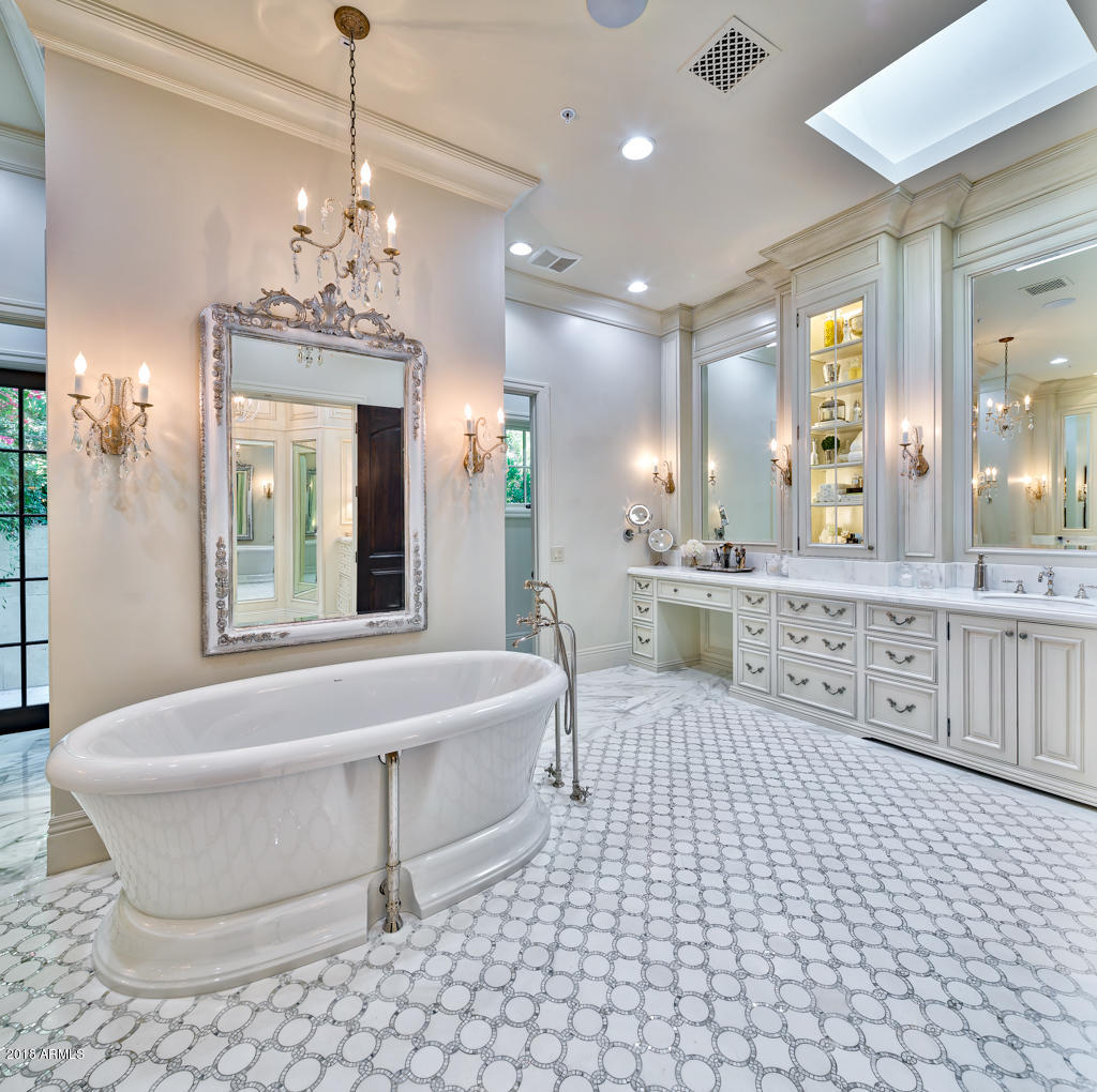 This 1.55 Acre Estate with Clay Tennis Court + 50 by 45' Pool has finishes and amenities belonging in an $8,000,000 home.This 8600sf home was completely renovated in 2015 w/2.6+ million in upgrades. Fabulous white marble designer kitchen with wall of 8 refrigeration drawers + 2 Subzeros.It opens to a lrg family rm opening to a lrg pub/game rm w/zinc bar counter + wall of wine refrigeration and disappearing glass doors.Pub flows into 65' outside living area + dramatic grounds.The elegant master has a stunning white marble bathrm,private hair salon,a fabulous women's closet w/separate shoe rm and exquisite designer cabinetry,2 exercise rms w/steam shower+Japanese soaking tub(can be 5th + 6th bedrms), add'l bedrms have their own pvt  studies. Wide plank walnut + white oak flooring thru-out. This property has an $80,000 European Hydro Clay Tennis Court and
it has a  55' by 40' salt water pool which is 10' at the deep end and has a separate  spill-in jetted hot tub.

There are drawings for an additional 3 car garage and
full guest house with separate media room.