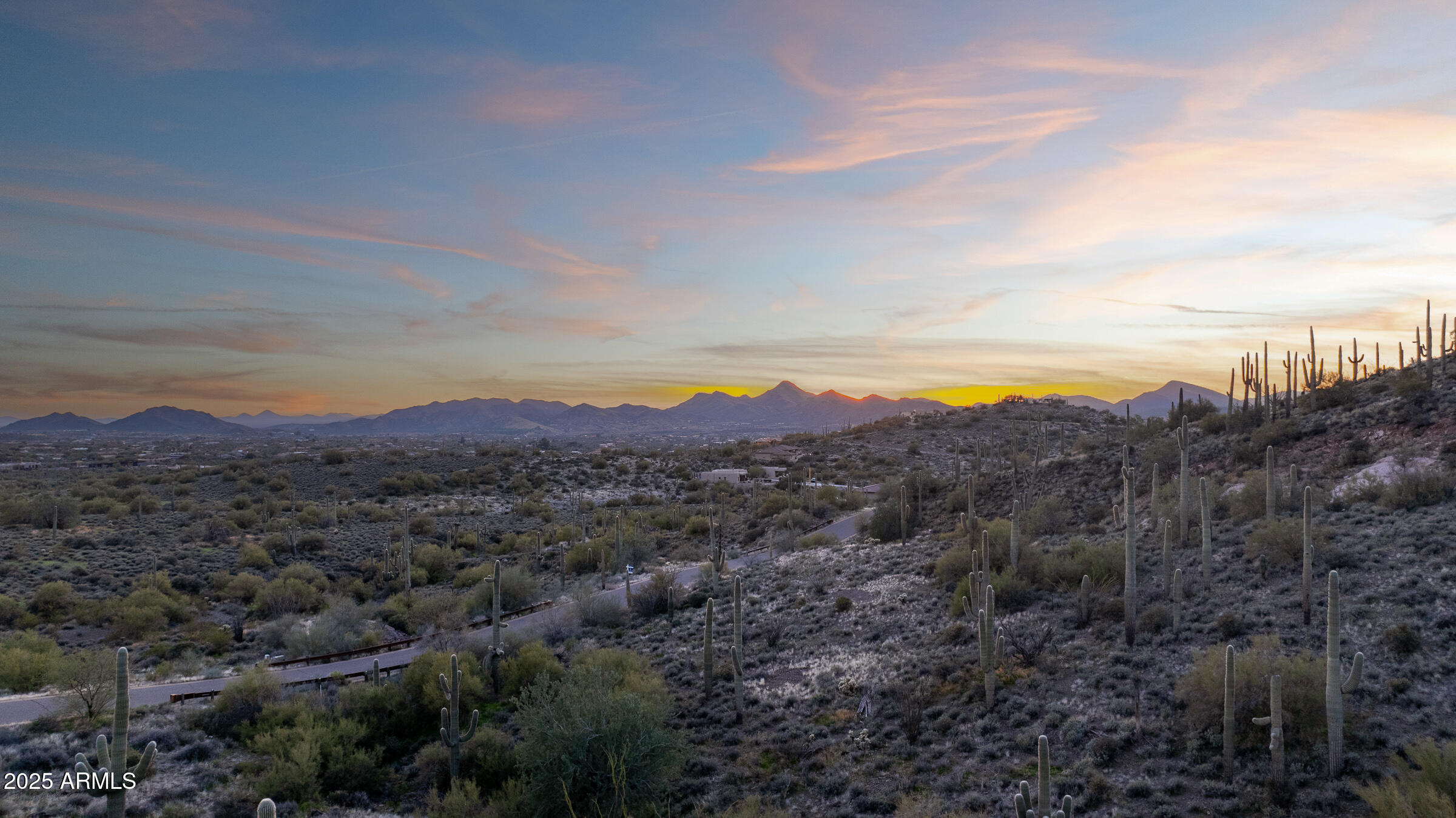 The Arrowhead property perched near the gateway to Continental Mountain Estates, a prestigious BedBrock luxury community where contemporary elegance blends seamlessly with the spirit of the ''Old West''. Encompassing 5.78 acres, this gently sloping hillside lot follows the natural contours of the mountain, embraced by iconic saguaro cacti and rugged desert landscape. Enjoy sweeping panoramic views of Black Mountain, the sparkling lights of Cave Creek and Carefree, and the distant beauty of Camelback Mountain on the horizon. As one of just four custom homesites in this exclusive enclave, the Arrowhead property offers the rare opportunity to collaborate with award-winning BedBrock Developers to create a one-of-a-kind desert sanctuary as an open canvas for your dream home. Experience the serenity of the desert while remaining just minutes from modern conveniences, striking the ideal balance between peaceful seclusion and everyday accessibility.