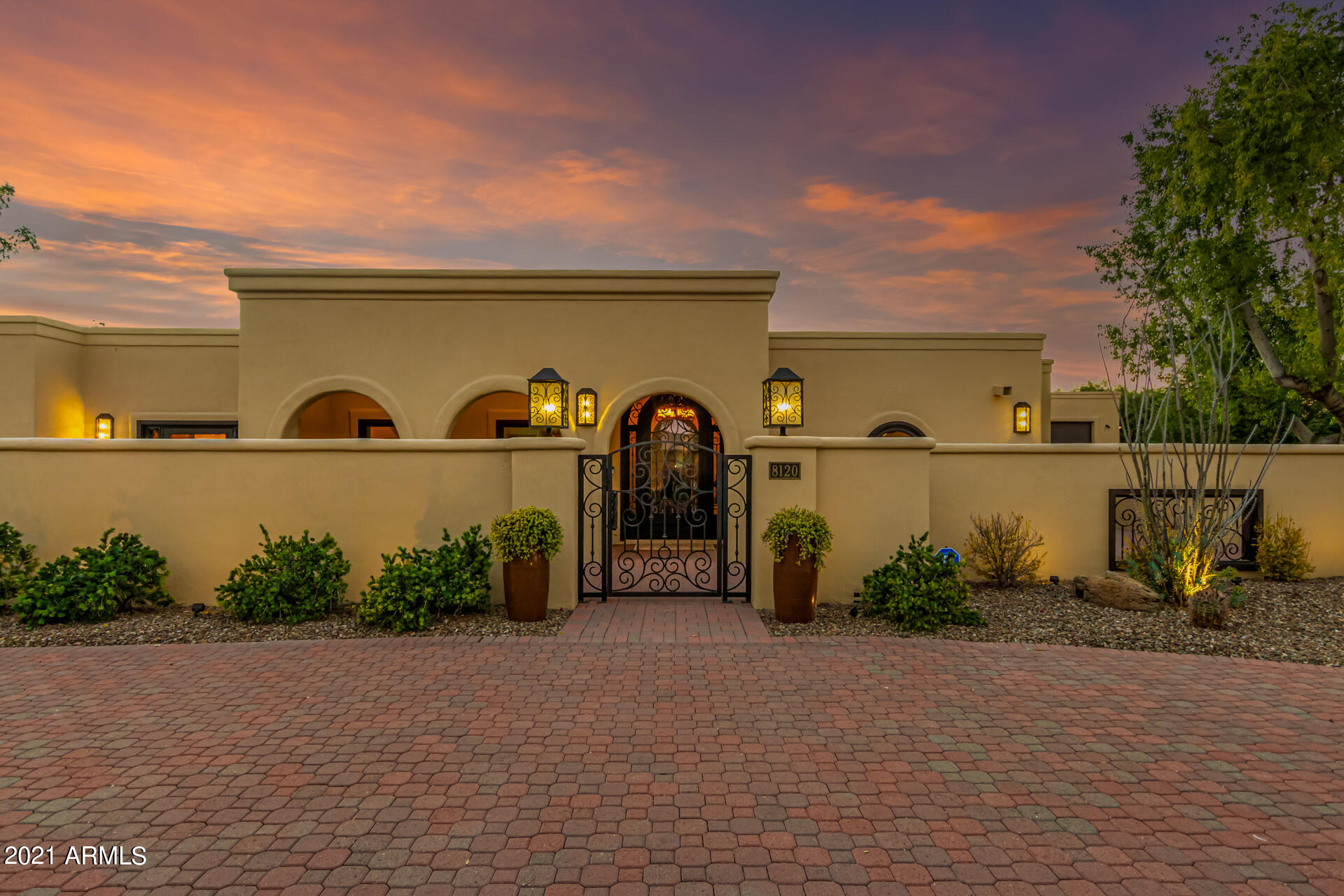 Car lovers delight in a prime Scottsdale location backing Paradise Valley Farms, situated on a substantial lot with mountain views!  Completely remodeled in 2014-15 and meticulously maintained. The main house boasts a cooks kitchen with beautiful solid Alder cabinets, quartz countertops, large island, SubZero SS refrigerator, Decor gas cooktop and two wall ovens, two dishwashers (one in butlers pantry), wine refrigerator, four spacious bedrooms, 2.5 baths, and attached two car garage.  Detached casita has one bedroom, full bath, living area, kitchenette, separate laundry room and one car attached garage.  Let's not forget about the 2019 built 5+ car detached garage with RV garage door on one side, car lift, 5 TV's, car washing area, and half bath, all located behind a private driveway with electronic gate.  The backyard provides abundant covered patio space to watch the colorful sunsets or enjoy the pool/spa.  Property is exquisitely landscaped for privacy with raised beds and mature fruit trees (pomegranate/lemon/orange/limes).  Don't miss this unique opportunity in a prime location!