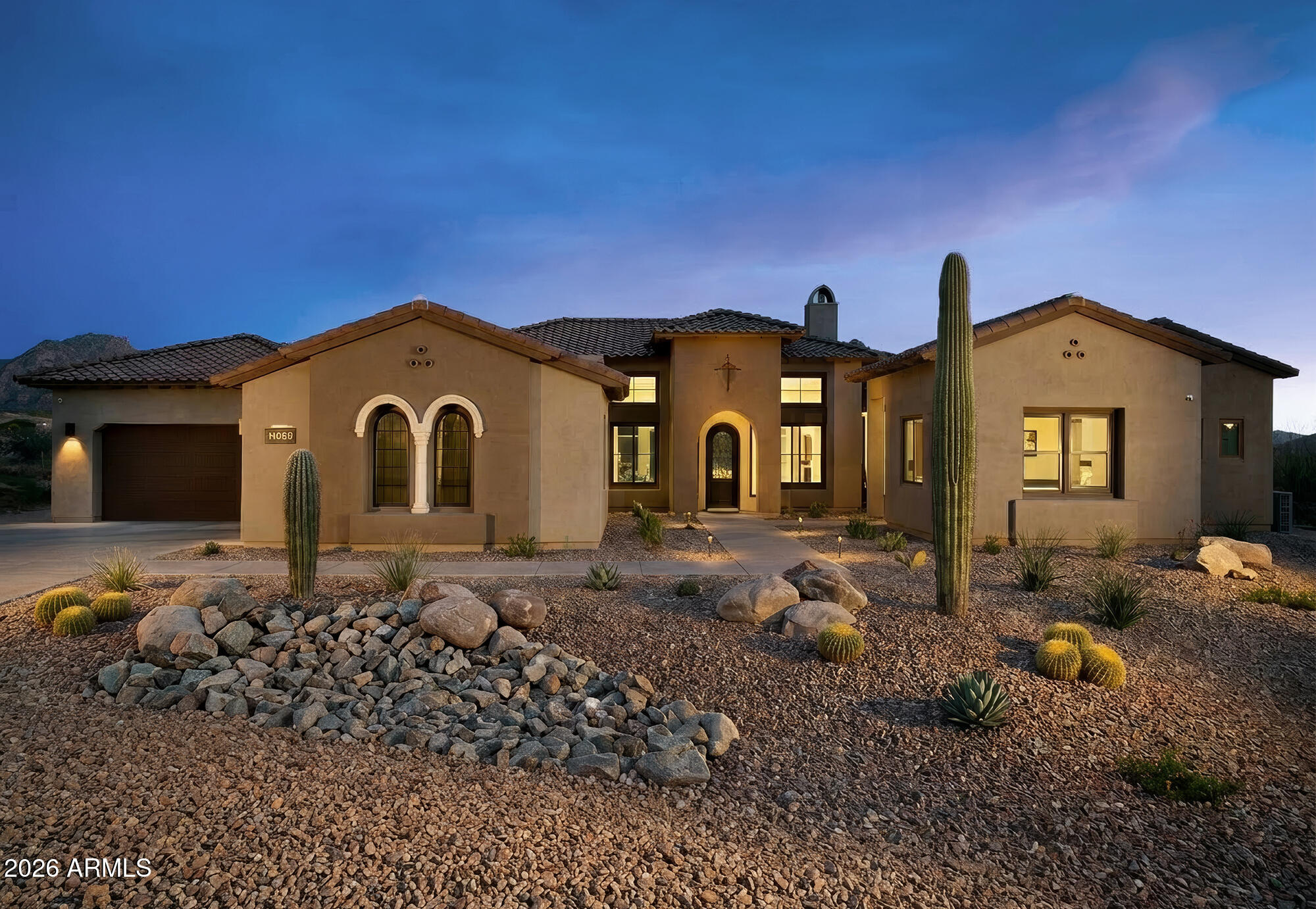 Built in 2025 by Toll Brothers, this single-level residence in the exclusive gated enclave of Ranch Gate Estates offers 4,801 square feet of refined desert living on a rare one-acre cul-de-sac homesite with commanding panoramic McDowell Mountain views and professional front landscaping currently underway. The open floor plan flows from a great room anchored by a gas fireplace, 13-foot ceilings, and walls of sliding glass that dissolve the boundary between indoors and the Sonoran desert beyond, to a chef's kitchen with a dramatic waterfall quartzite island, gas cooktop, Sub-Zero & Wolf appliances, and pantry. Eleven-foot ceilings continue through the living areas. A dedicated office and bonus room offer flexible space for work, media, or fitness. Resort inspired master bath with dual vanities, a separate shower, and a soaking tub. Two additional en suite bedrooms offer privacy and comfort for family or guests. A separate 625 square foot two-room casita completes the layout, ideal for multigenerational living or a private guest retreat. An oversized four-car garage, three covered patios designed for seamless indoor-outdoor desert living, and a favorable north/south exposure that maximizes comfort year-round complete the package.

The one-acre lot is a rare blank canvas in 85255. No inherited design decisions. Build your pool, outdoor kitchen, and entertaining space exactly as you envision it, in one of the most coveted zip codes in the country. Steps from the McDowell Sonoran Preserve and 75 miles of world-class trails, minutes from premier golf, dining, and shopping. Toll Brothers quality. Four-car garage. One acre. Unobstructed mountain views. Your backyard. Your vision. Price includes a $100k pool allowance.