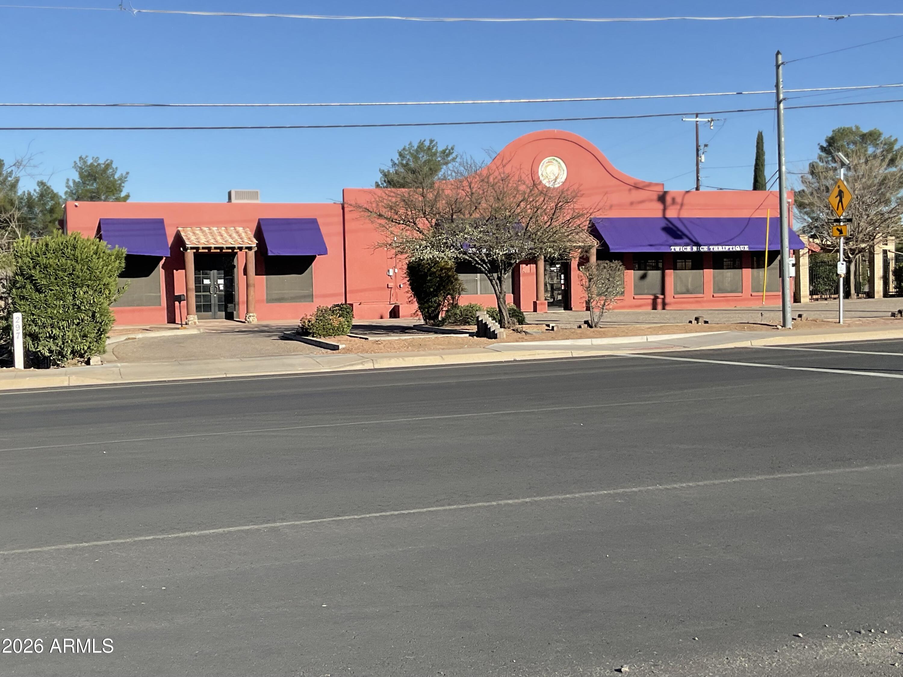 Hi traffic, corner location for retail business. Over one acre with 6600 sqft store and multiple shaded pergolas. Updated natural gas heat and central A/C units. Plenty of off-street parking in front & along street side. Wrought iron security fenced, and room for outside displays. Large glass windows make interior light & bright. Two separate parcels combine for over one acre. Loading dock/door in rear. Full basement is low ceiling, but excellent interior storage, with garage door entrance. Existing garage in rear needs work, portable building not included in sale.  Large 8' by 5' lighted monument sign at corner.