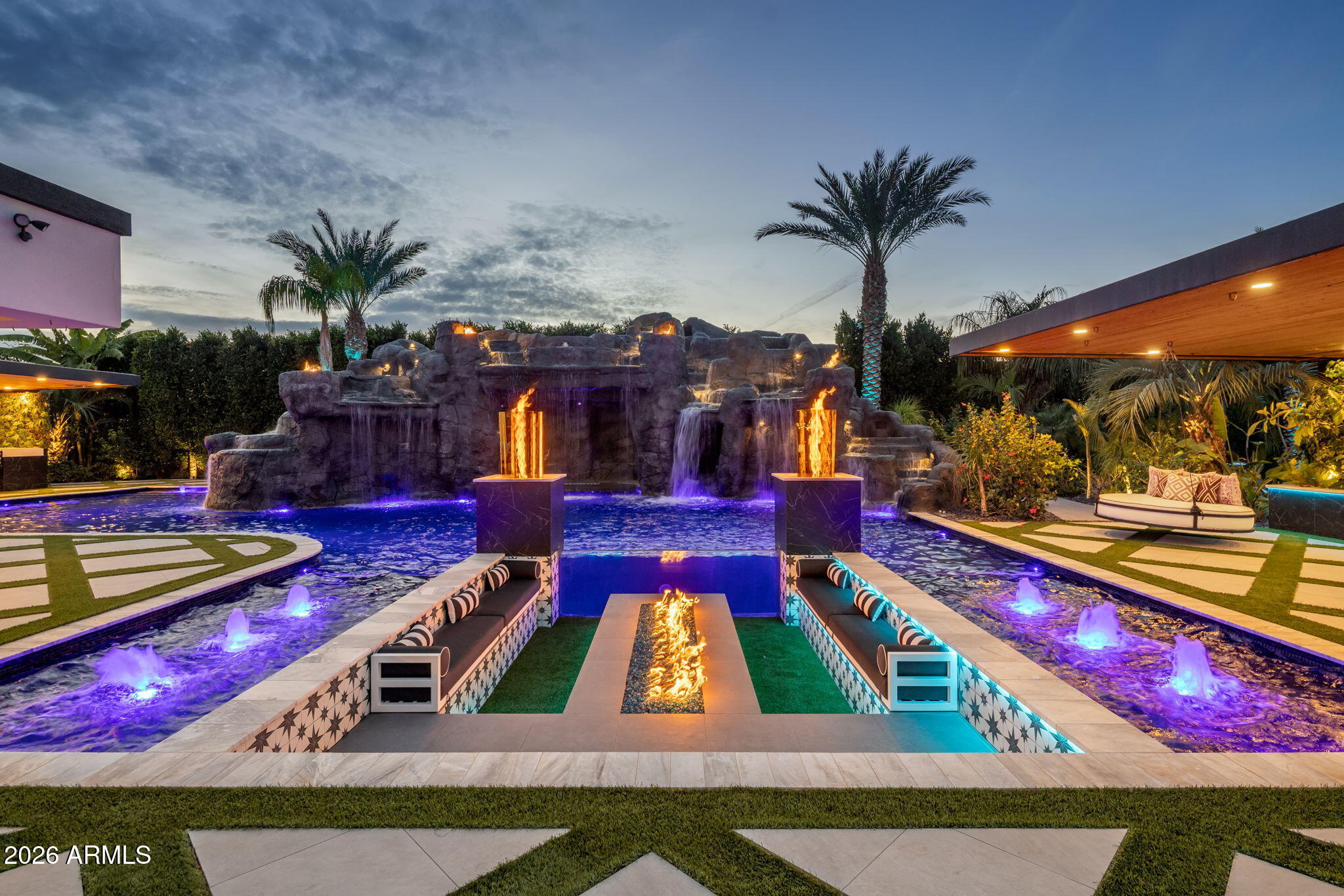 Tucked behind lush, ultra private grounds in the heart of Gilbert, this one of a kind estate delivers an unmatched blend of luxury, creativity, and resort style living. Designed as a true experience driven property, every detail has been thoughtfully curated to elevate both everyday living and large scale entertaining.

The 5,340sf main residence offers 4 bedrooms, 5.5 bathrooms, a gym, and a pool bath  complemented by a detached ~740sf guest casita with 1 bedroom and 1 bathroom. Indoor and outdoor spaces flow seamlessly into an extraordinary setting that rivals high end resorts. A showstopping pool anchors the backyard, complete with a 60 ft corkscrew waterslide winding through a custom rock waterfall grotto. The swim up grotto lounge features built in seating, bar cave, TV area, WiFi.. and dynamic lighting, creating a truly unforgettable experience.

The grounds offer a rare level of recreation and entertainment with a professional pump track, multi sport court with stadium lighting, and a putting green with custom bunker. Multiple gathering areas are enhanced by custom fire features and a fully integrated sound system that extends throughout the property and into the pool.

Wellness and lifestyle amenities include a hybrid sauna, dual cold plunges, steam shower, and a private gym with ensuite bath. The 12-car garage is finished with commercial grade epoxy flooring and accompanied by additional RV or bus parking with full power and plumbing hookups.

Surrounded by a mature 20 to 25 foot ficus hedge and curated landscaping with rare imported plant species, the property offers exceptional privacy and a true resort feel.

Built by the founder of Dixxon Flannel Co. as a personal passion project, this home has been featured on HGTV, Fox News, and Channel 3 Phoenix. It also presents strong income potential with as a luxury short term rental.

A rare opportunity to own a property that delivers on experience, design, and income potential all in one remarkable setting.
