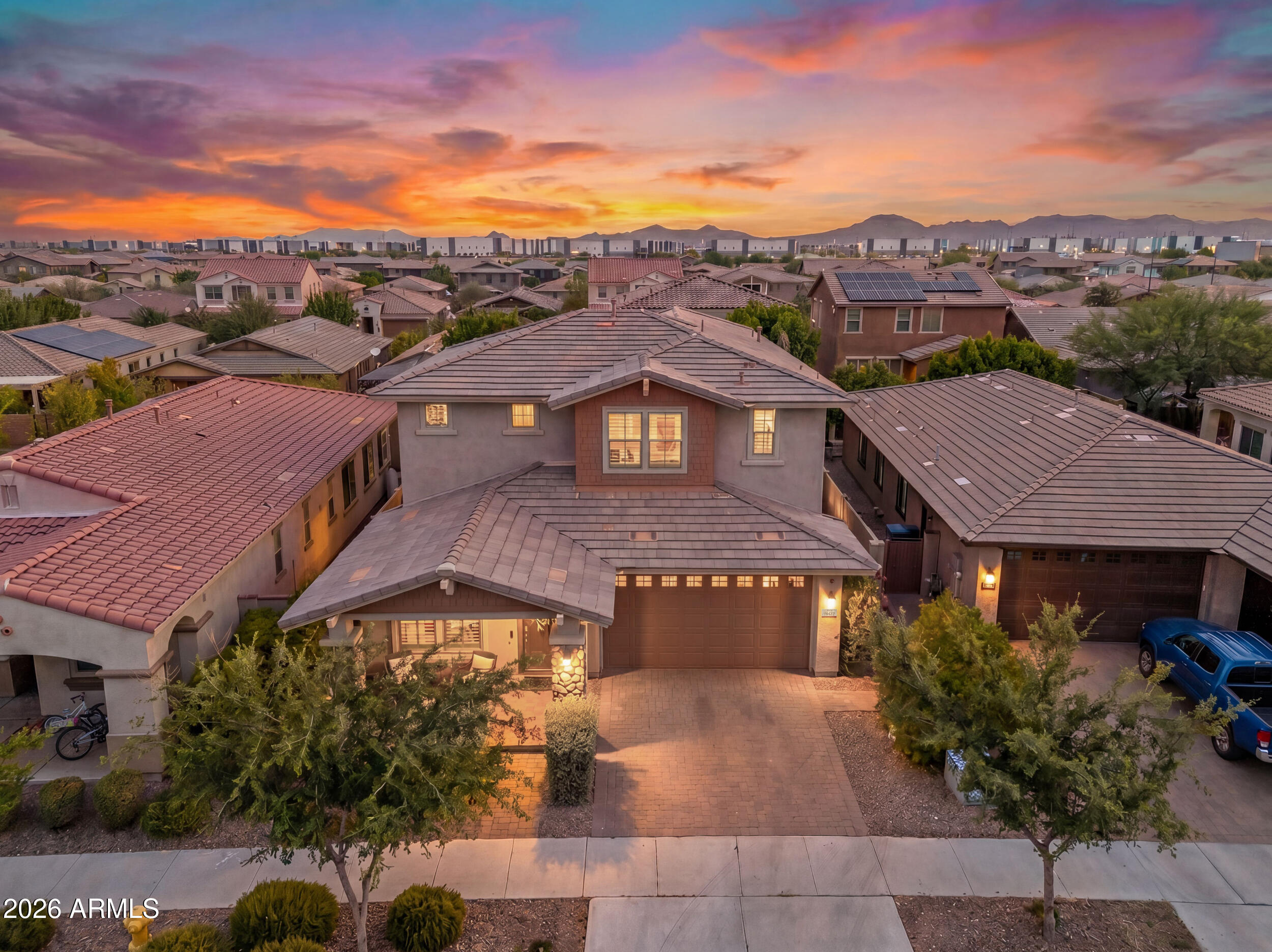 Exceptional space, thoughtful design, and resort-style outdoor living come together in this beautifully maintained Mattamy home offering over 3,200 square feet, 5 bedrooms, 4.5 bathrooms, a first-floor primary suite, a 3-car tandem garage, and one of Eastmark's most sought-after floor plans, all for under $700,000.

Designed for both everyday living and effortless entertaining, the open-concept layout is anchored by a spacious great room that flows seamlessly into the gourmet kitchen. Complete with granite countertops, stainless steel appliances, a gas cooktop, oversized center island with seating, a walk-in pantry, and abundant cabinetry, it's a space where everyone naturally gathers. The highly desirable first-floor primary suite creates the perfect private retreat, featuring a spacious bedroom, large walk-in closet, dual vanities, a soaking tub, separate walk-in shower, and private water closet. Also on the main level is a versatile den, ideal for a home office, playroom, fitness room, or guest space. Upstairs, an expansive loft provides a second living area perfect for movie nights, game days, or a kids' retreat, while the additional bedrooms offer flexibility for growing families, multigenerational living, or overnight guests.

Step outside to your own backyard oasis where a heated saltwater pool is surrounded by lush landscaping, creating exceptional privacy and a true resort-like setting. Whether you're enjoying a quiet morning coffee, entertaining friends, or unwinding after a long day, this backyard was designed for year-round Arizona living.

Additional highlights include a cozy gas fireplace, North/South exposure, dual-pane windows, generous storage throughout, and a spacious 3-car tandem garage with room for vehicles, recreational gear, or a workshop.

Located in the award-winning Eastmark community, residents enjoy resort-style amenities including The Mark clubhouse, community pool, splash pad, parks, lakes, walking and biking trails, tennis courts, playgrounds, and a vibrant calendar of neighborhood events. Just minutes from top-rated schools, shopping, dining, and convenient freeway access, this home offers the exceptional lifestyle that continues to make Eastmark one of the Valley's premier master-planned communities.

Key Home Features:

First-floor primary suite
Dedicated downstairs den + spacious upstairs loft
Heated saltwater pool
3-car tandem garage
5 bedrooms | 4.5 bathrooms | 3,221 SF
Highly desirable Eastmark location
Under $700,000