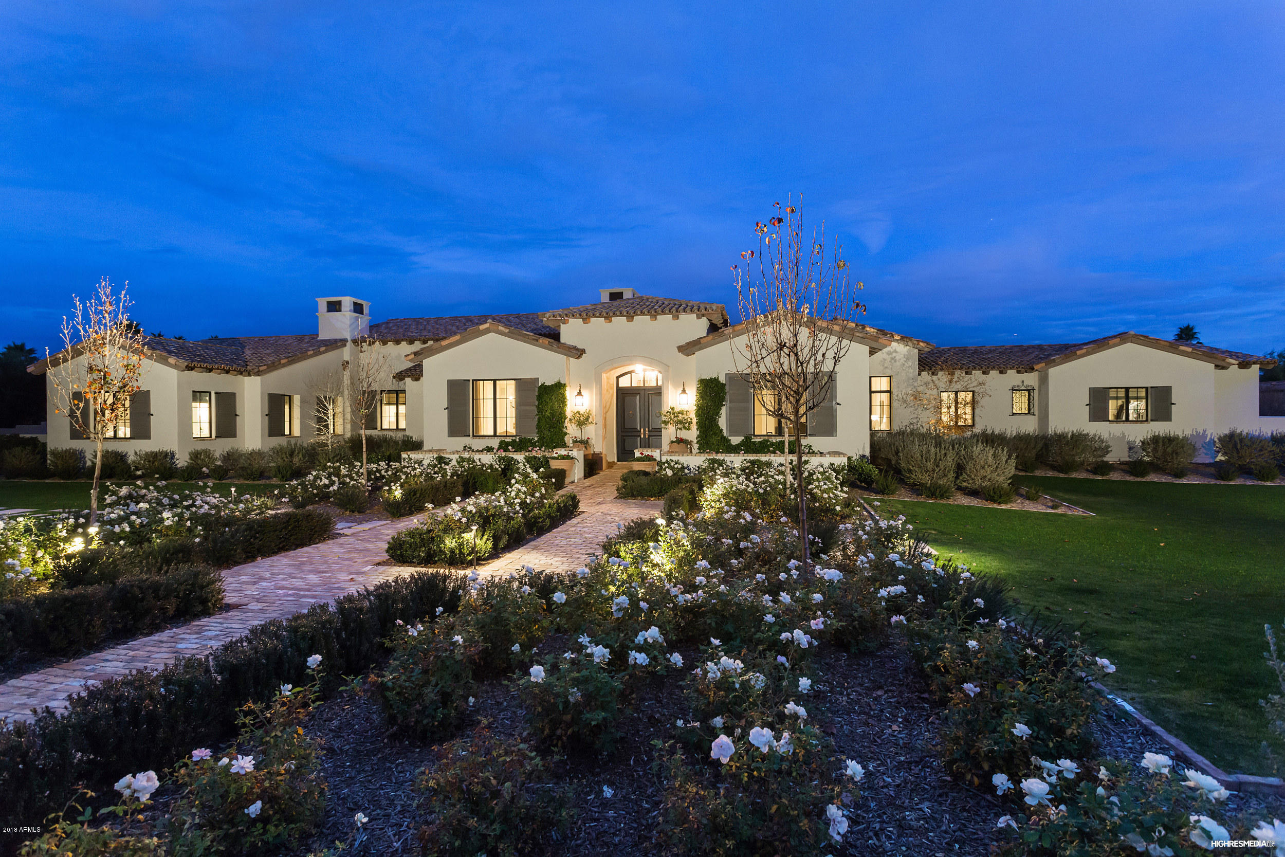 Renowned architect Erik Peterson of Phoenix Architecture created this awe-inspiring home with tons of love from the owners. This estate is a masterpiece of design and craftsmanship built by Calvis Wyant in 2016 and features 4 br's, and an office in the main house + a guest casita complete with living room, kitchen and covered ramada. From the retractable doors that disappear into the walls and reclaimed beams in great room to the glorious millwork, you will not want to miss this extremely special estate. Home features a chef’s kitchen with Calcutta marble island all overlooking the charming great room and hand carved Limestone fireplace. Lovely East facing breakfast room adjoins the kitchen and overlooks the refined gardens, lush grass, pool & jacuzzi. Peaceful Master suite is complete with his/hers closets, beverage center + beautiful tranquil bathroom with honed Carrara Marble countertops. Secondary Guest suites are generously sized w/ large walk-in closets and lots of natural light. Guest baths feature Belgian blue stone floors, and honed Cararra Marble vanities. The exterior landscape design is by Refined Gardens and offers an Old Chicago Brick patio, many lush varietals of blooming vegetation and a soothing fountain. Extraordinary covered patio features built-in BBQ and in-ceiling Infratech Heaters. The outdoors are complete with a multitude of spaces for intimate seating and wine sipping by fire pit  This home abounds with charm and the feeling of serenity; it will sell quickly so call for a private showing today!!