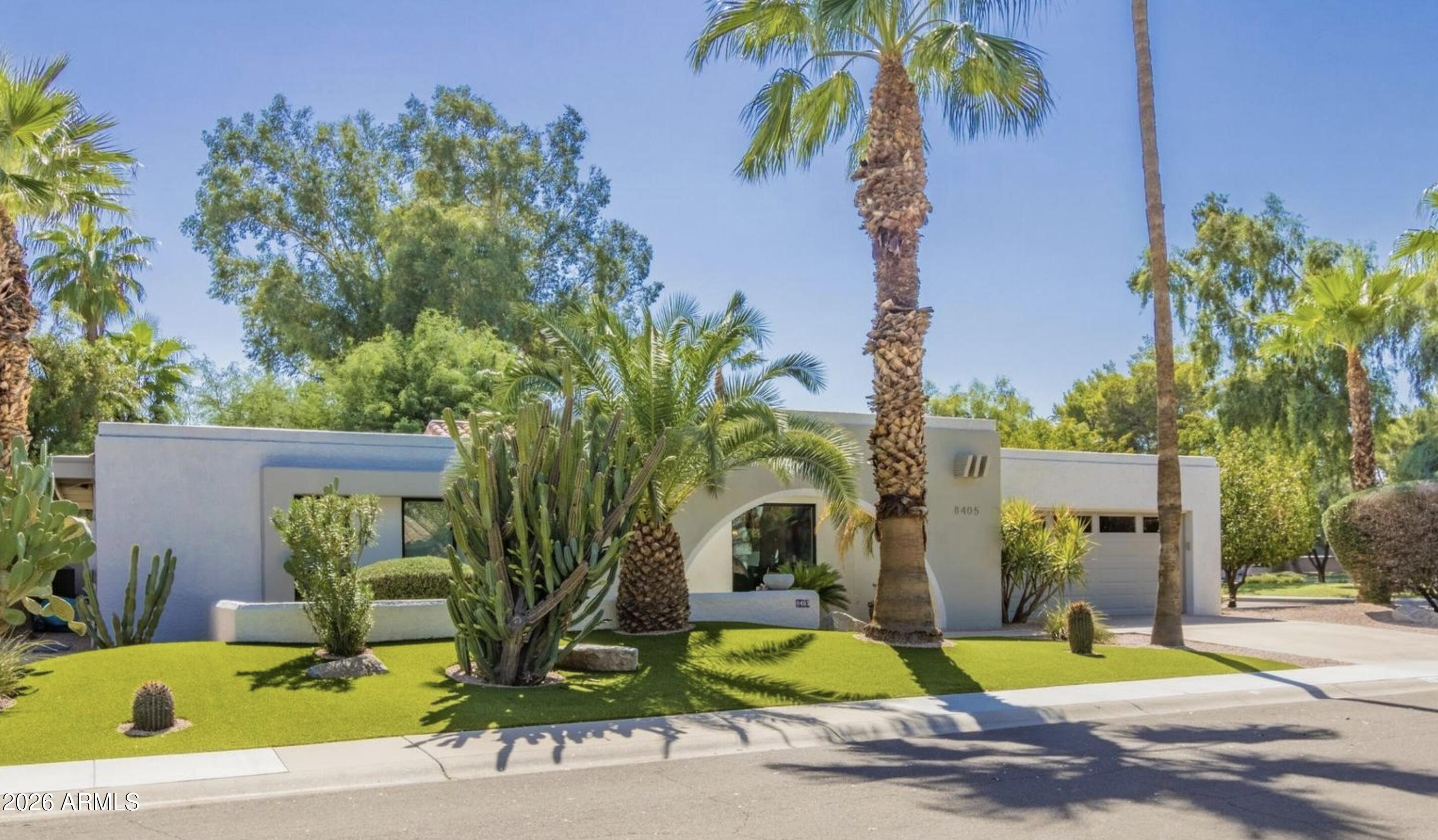 Extensively remodeled and set on a spacious corner lot in the heart of McCormick Ranch, this home offers refined single-level living with seamless indoor-outdoor flow. Vaulted ceilings, skylights, Provenza hardwood flooring, dual fireplaces, Milgard windows and doors, and expansive living spaces create a warm yet sophisticated aesthetic. The chef's kitchen opens effortlessly to multiple entertaining areas and a private backyard featuring a resurfaced saltwater pool, mature landscaping, and ideal North/South exposure. Just minutes from the Indian Bend Wash Greenbelt's lakes, biking and walking paths, golf, pickleball, luxury resorts, spring training, dining, Old Town Scottsdale, Scottsdale Fashion Square, Kierland Commons, and Scottsdale Quarter.