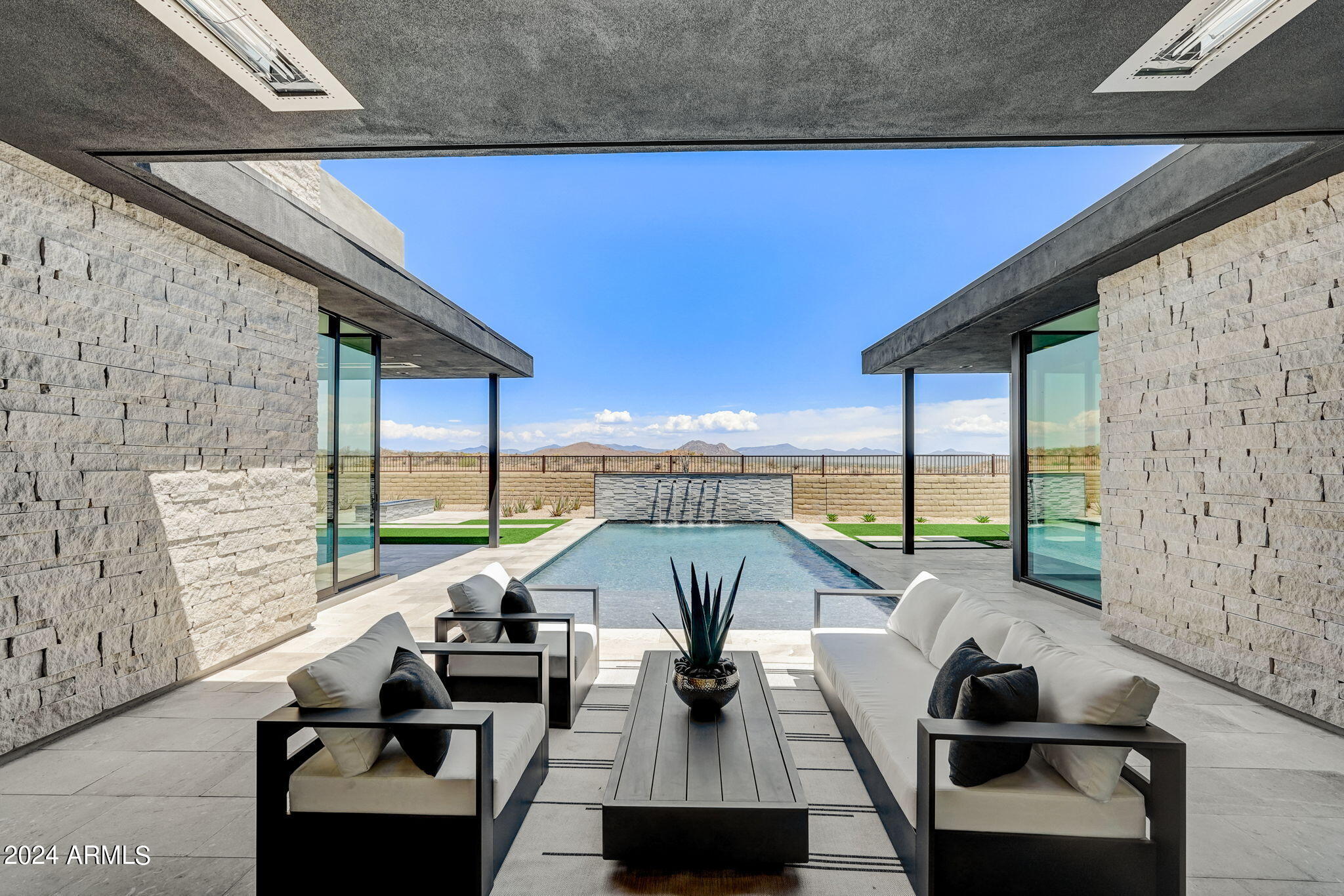 **AGENTS - Please read private remarks** 
This fantastic new construction home features a Full Landscape Package with Pool, Gourmet Kitchen, A Spacious Back Prep Kitchen, Urban Style Aries Cabinets, Modern Tile Flooring, Quartzite Counters with Waterfall Edge on Island, Contemporary Iron Entry Door, Infrared Ceiling Patio Heaters, 12ft Rolling Wall of Glass at the Nook and a 20ft Rolling Wall of Glass at the Great Room. With trails offering access to the Preserve and its 150+ mile trail network, life at Storyrock includes convenient access to Tom's Thumb and endless opportunities to enjoy nature. Storyrock offers a rare opportunity to live within close proximity to the best of Scottsdale while also among Arizona's timeless natural treasures, all within a distinctly modern setting.