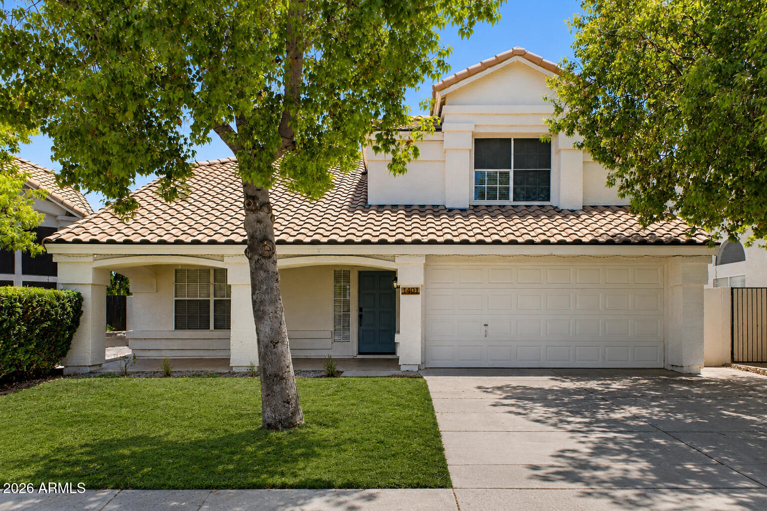 Step through the front door to soaring vaulted ceilings and a bright, open feel. Wood flooring and shiplap accents run throughout, giving the home a clean farmhouse-chic style. The low-maintenance backyard features artificial turf and pavers--ideal for relaxing or entertaining. Residents enjoy the Val Vista Lakes amenities, including a heated community pool, tennis courts, walking paths, a clubhouse, and a fitness facility. A move-in-ready home in one of Gilbert's premier lake communities.