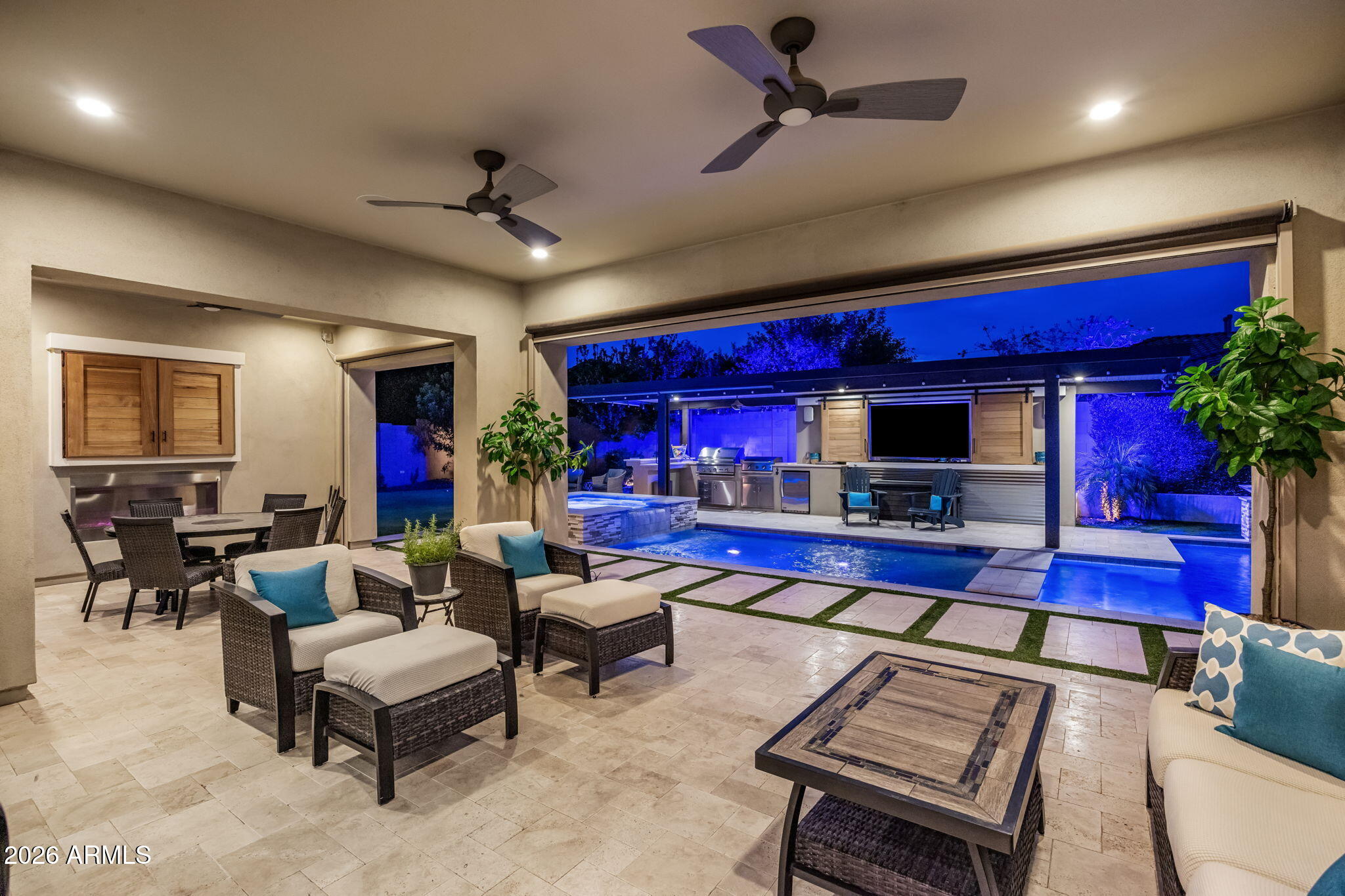Situated within the prestigious gated community of The Reserves at Val Vista, this exceptional 4159 sq ft residence offers a rare blend of sophisticated design, thoughtful craftsmanship, and resort-inspired living. Featuring 4 bedrooms, 4.5 baths, an Executive Office, Game Room, & an attached Casita with its own private entrance, this home is perfectly designed for multigenerational living, guests, or a private executive retreat.  Set on an expansive 14,855-square-foot homesite, the property showcases over $376,000 in premium upgrades and enhancements.  The thoughtfully designed interior showcases plantation shutters throughout, custom shiplap accents, designer wall treatments, crown molding, solid-core doors, custom built-ins, & a stunning illuminated wet bar complete with a 
Scotsman ic maker, beverage cooler, & sink. At the center of the home, the gourmet designer kitchen impresses with an oversized gathering island, premium built in GE refrigerator, gas Thermador stove, with two ovens + additional Thermador oven, upgraded microwave, custom cabinetry, generous prep space, & seamless connection to the great room & dining areas--creating the perfect setting for both intimate gatherings & large-scale entertaining. Modern conveniences include a Sonos audio system, smart ceiling fans, central vacuum, water softener, dual reverse-osmosis systems, V-Cool energy-efficient window film, and extensive hidden insulation upgrades for enhanced comfort & efficiency.
The backyard is a true private resort. A spectacular heated saltwater pool & spa serve as the centerpiece, featuring dual filtration systems, waterfall bowls, with a big firewall, illuminated bubblers, floor jets & an oversized 10x20 sun shelf. The 34-foot ramada provides the ultimate outdoor entertainment experience with electricity, lighting, two outdoor televisions, & a fully equipped outdoor kitchen complete with Delta Heat BBQ, stainless steel Le Griddle, refrigerator, & cooler.  Additional outdoor amenities include a five-hole putting green, fire place on patio, extensive landscape lighting, mature fruit trees, raised garden beds, travertine hardscaping, artificial turf, RV gate access, paver parking area, & two storage sheds.  Every detail of this residence has been meticulously curated to create a turnkey luxury lifestyle that seamlessly blends elegance, comfort & exceptional entertaining. All of this, plus Top Rated Schools!  Don't let this Amazing opportunity pass you by.