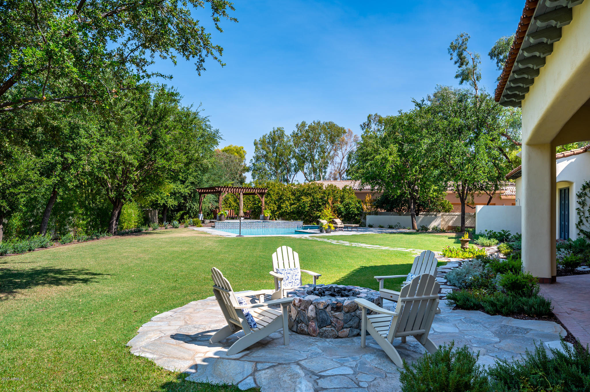 Located in the heart of Paradise Valley you won't want to miss this custom home on one of the best streets in Paradise Valley.  The home was built by Catalina Homes with a stunning new backyard by Refined Gardens in 2019.  This transitional  home boasts 100 yr old plank wood flooring, handmade wood mullioned windows with French hardware, rough chiseled vintage beams, furniture grade cabinetry and french doors that open to private patios/courtyards throughout the home.  The attached guest casita has a full kitchen, separate bedroom with walk in closet, full bath, washer/dryer, living room with fireplace and separate garage entrance. The main home includes 4 en suite bedrooms plus exercise room and two offices. The resort style backyard has it all including newly remodeled pool, spa, pergola bocce ball court, vegetable gardens, sport court, built in BBQ and  fire pit